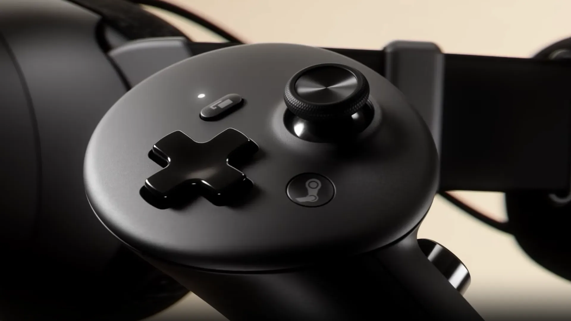 Close-up of a black Steam Frame motion controller showing its D-pad, TMR thumbstick and Steam button.