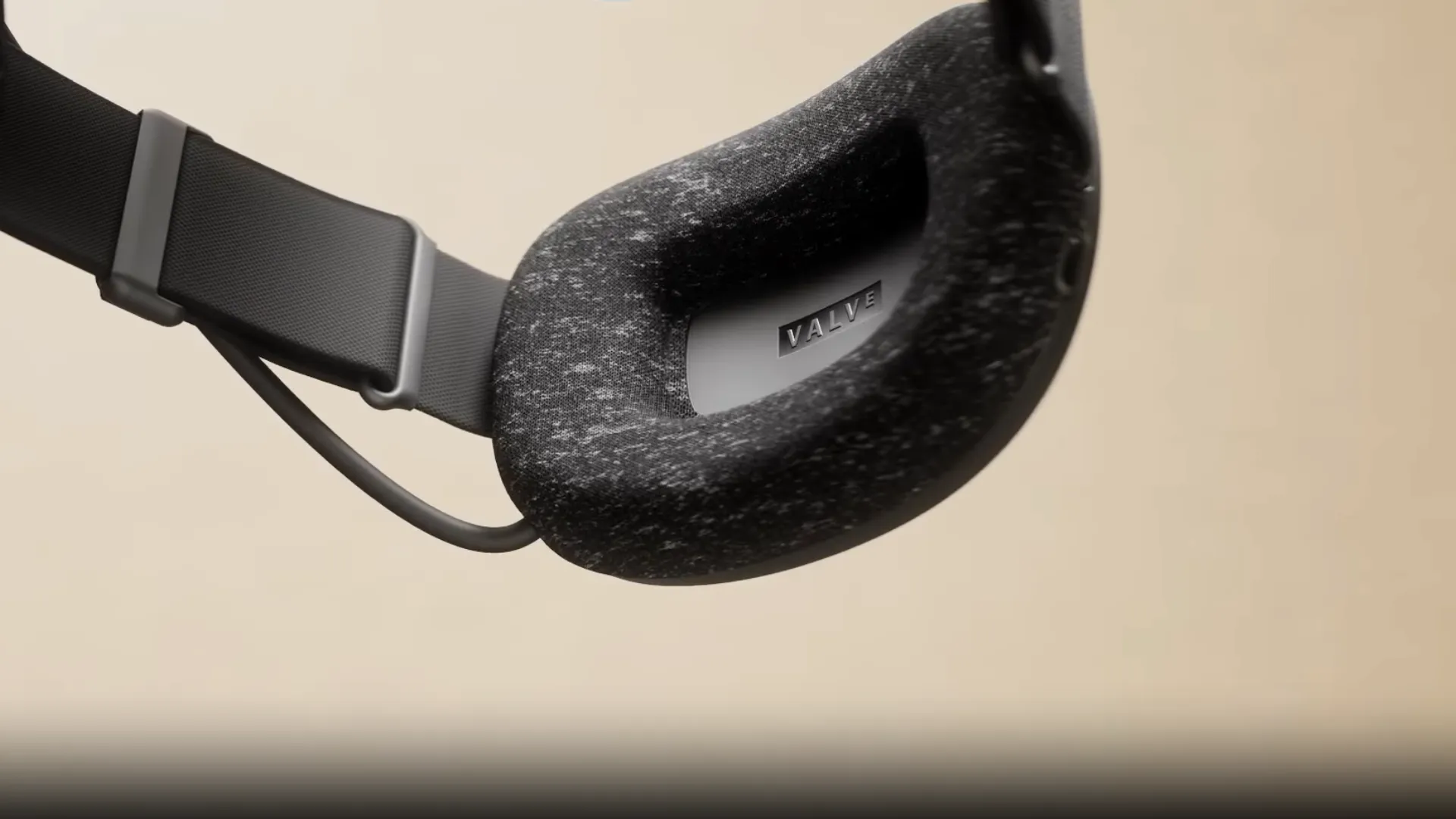 Close-up of the rear Steam Frame head strap with the Valve-branded battery section and attached cable.