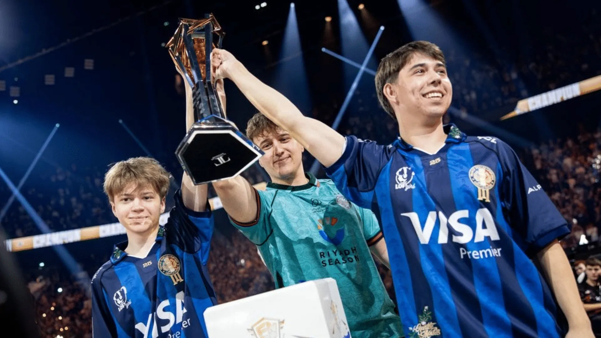 SwizzY, Queasy and Merstach lift the 2025 Fortnite Global Championship trophy on stage