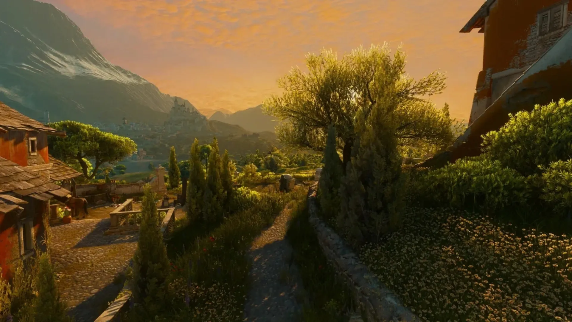 Sunset over a mountain village and countryside in The Witcher 3 Remastered