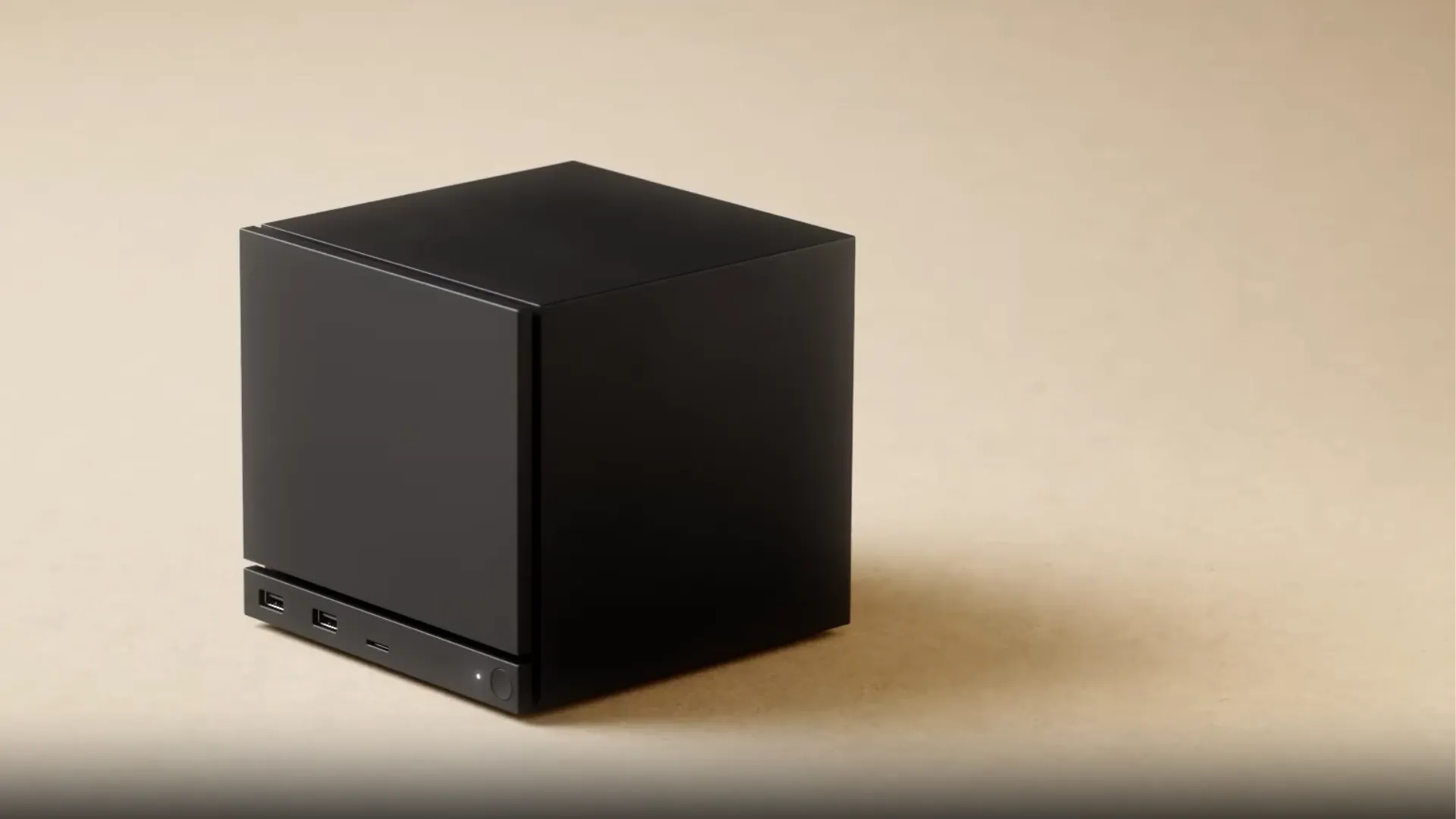 Black Valve Steam Machine shown from the front with USB ports, indicator light and power button visible.