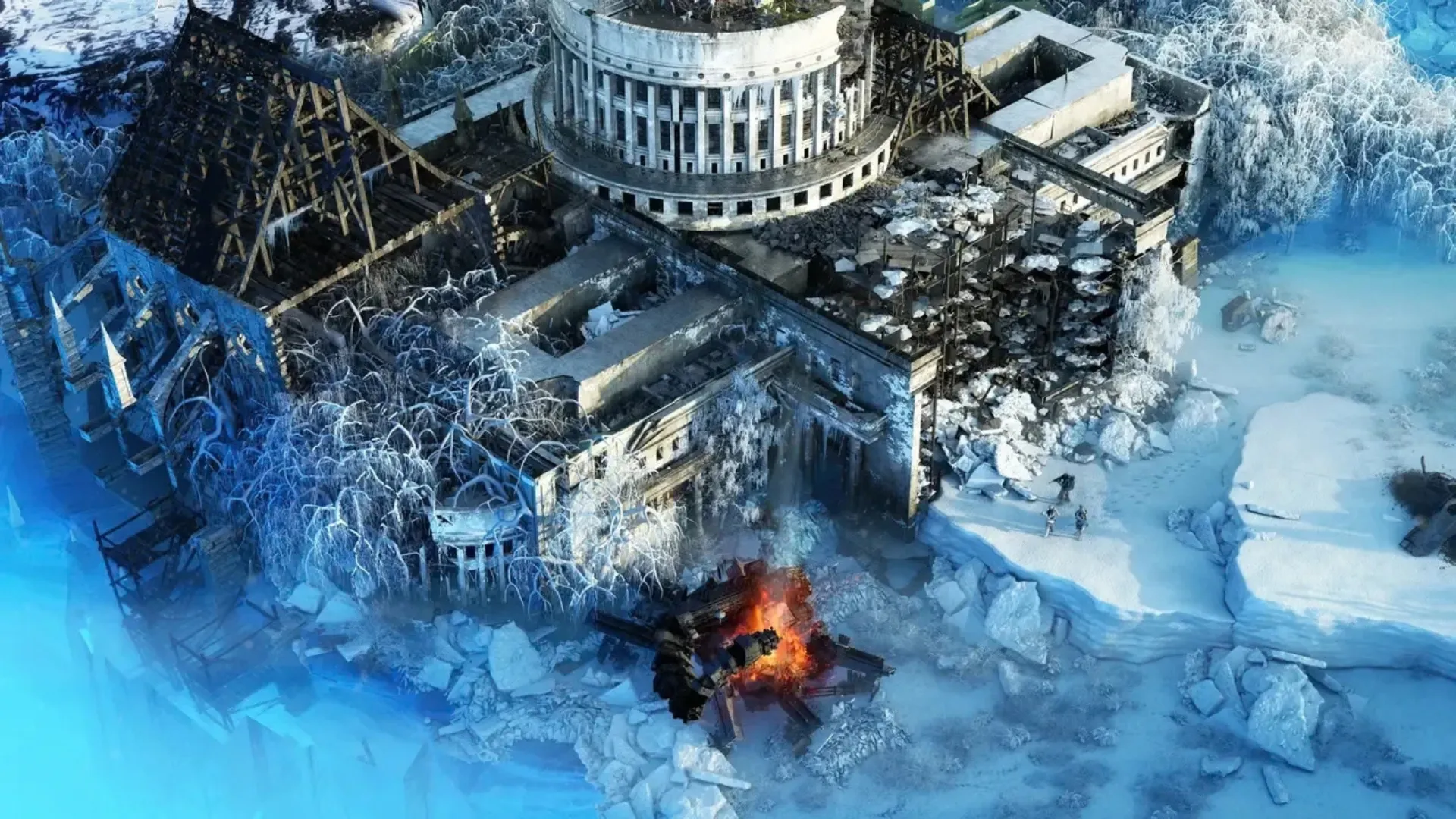A ruined snow-covered complex and burning wreck in Wasteland 3