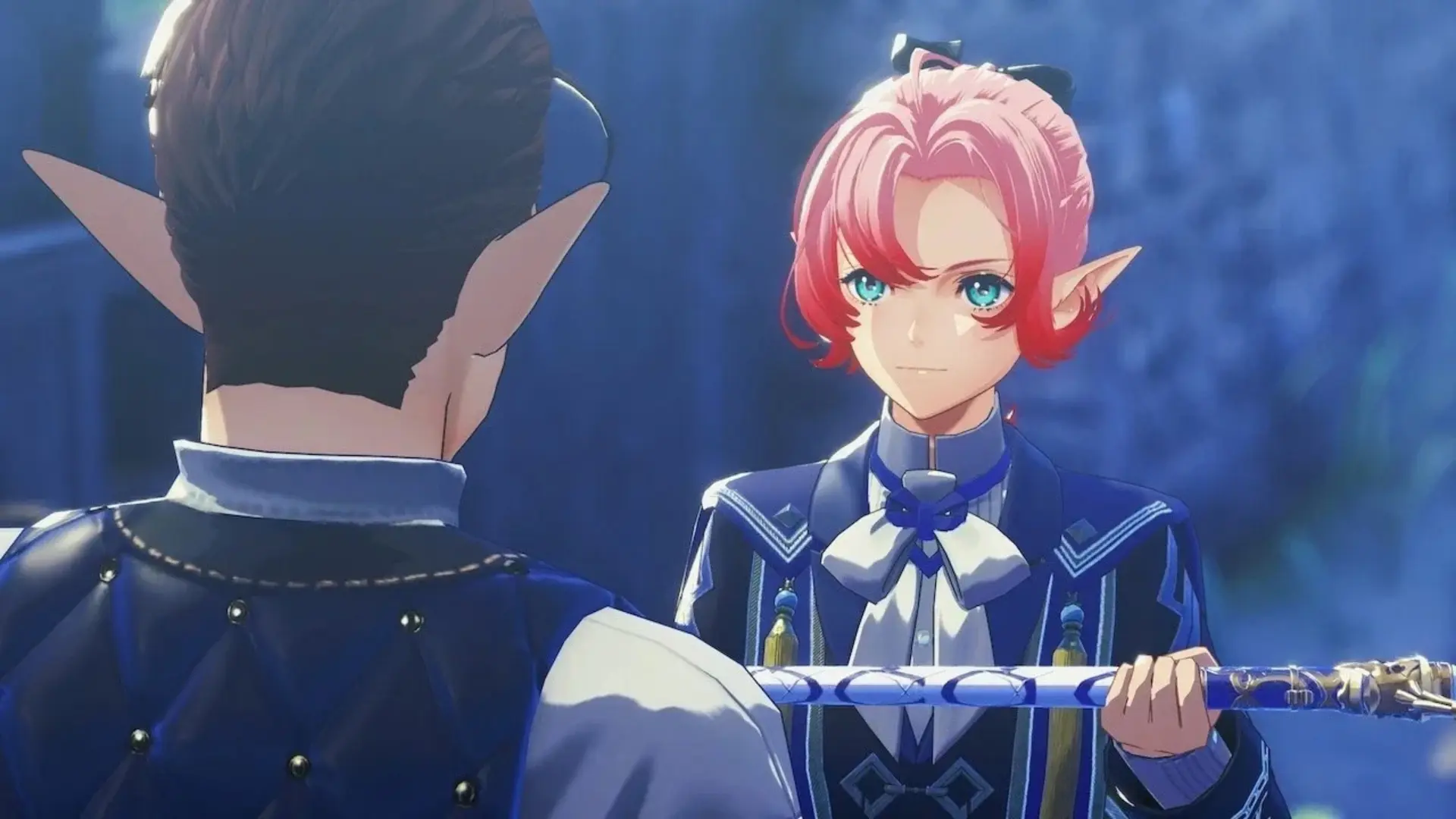 A red-haired character holding a staff speaks with another character in Xenoblade Genesis