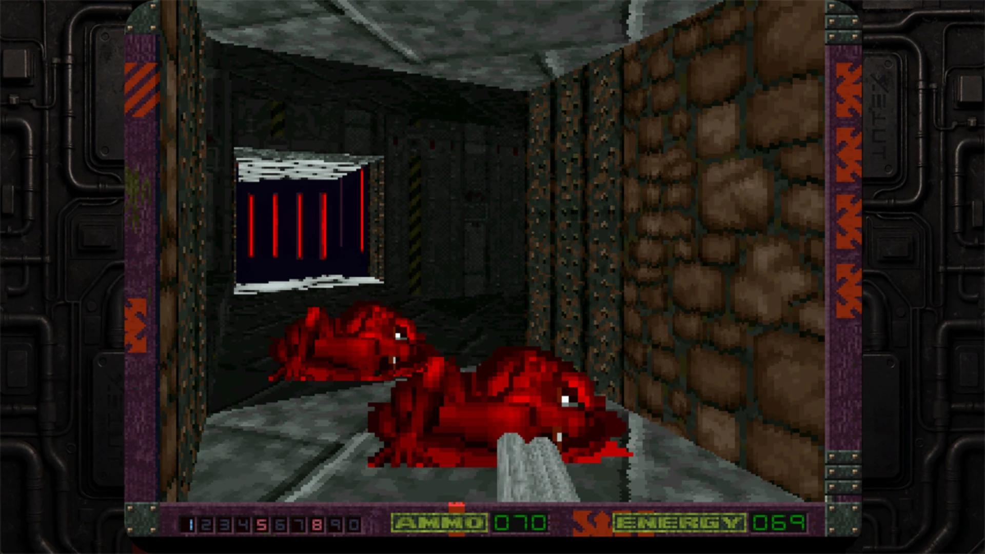 Two red alien creatures approach the player in a dark industrial corridor in Alien Breed 3D