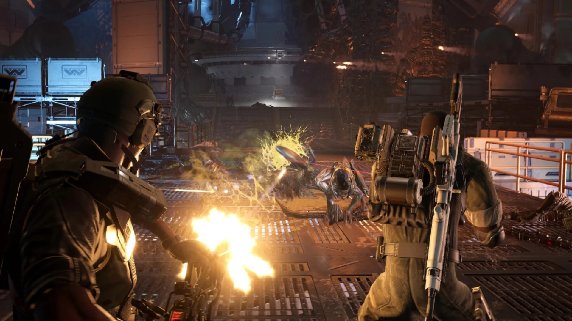 Colonial Marines fire on approaching Xenomorphs inside an industrial facility in Aliens: Fireteam Elite 2.