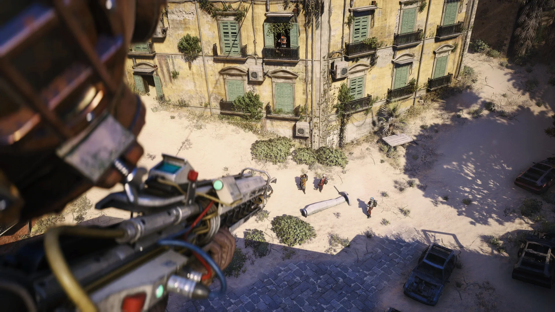 A Raider aims a weapon at three players below in a sunlit ruined courtyard in ARC Raiders.