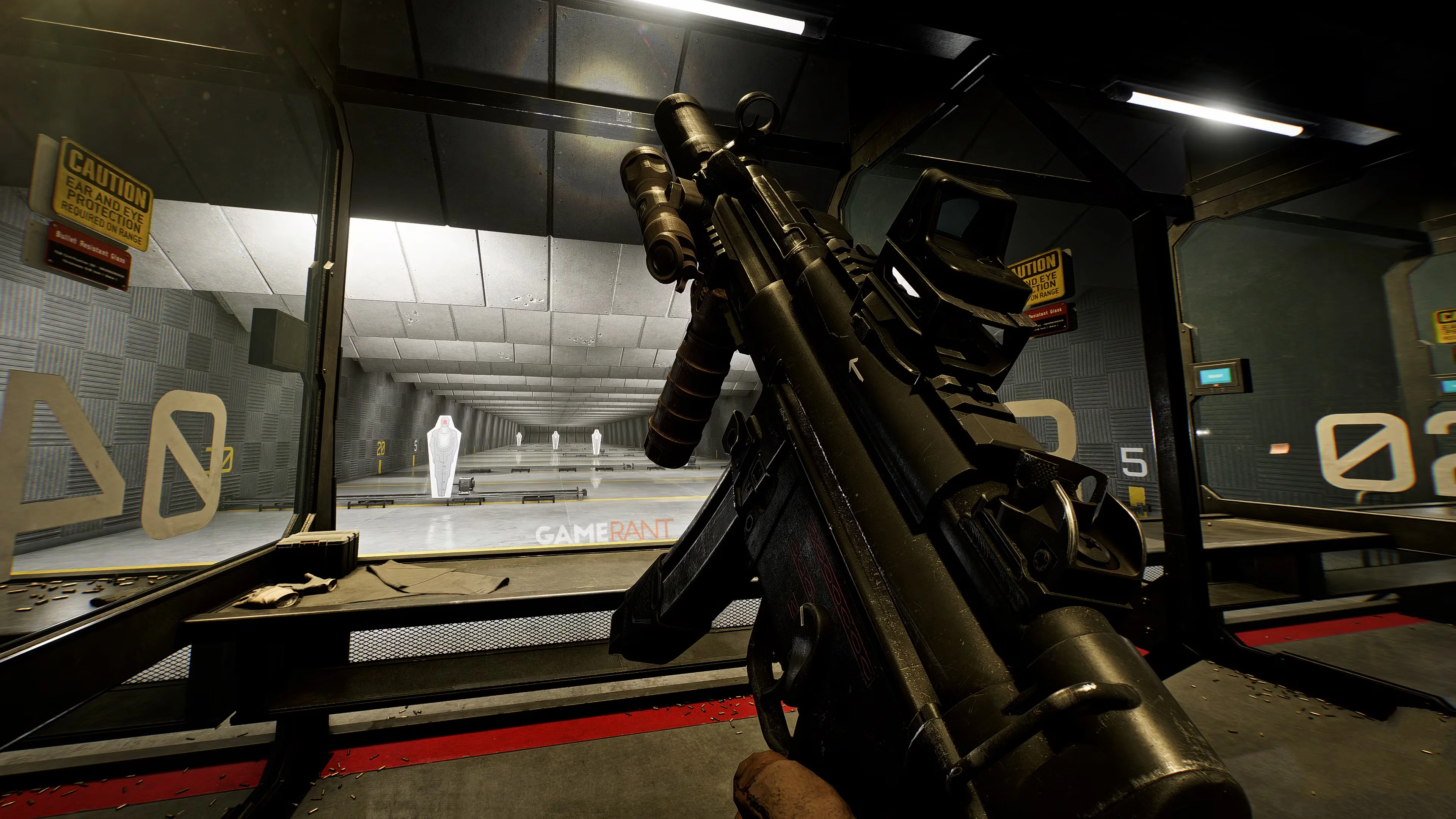 First-person Battlefield 6 gameplay shows a detailed assault rifle being handled inside an indoor shooting range with practice targets.