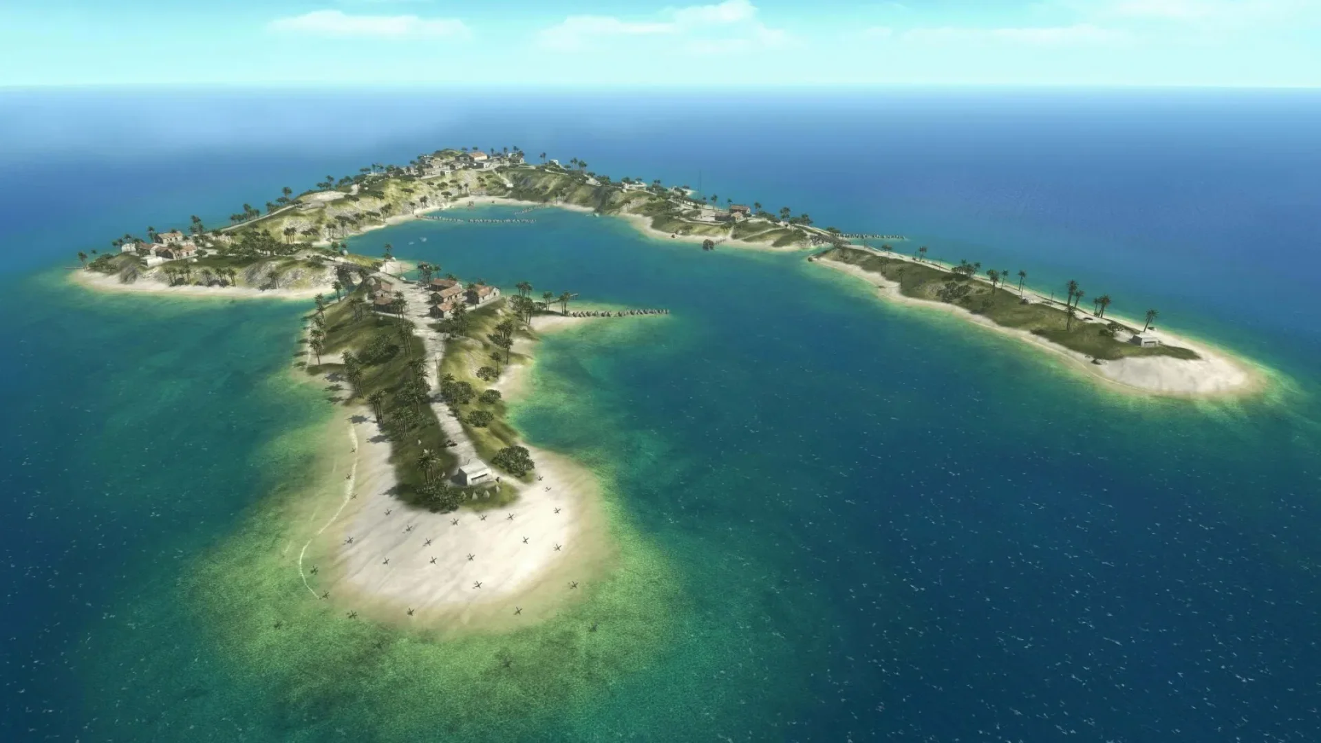 Aerial view of Wake Island showing its curved shoreline, beaches, roads and surrounding ocean.