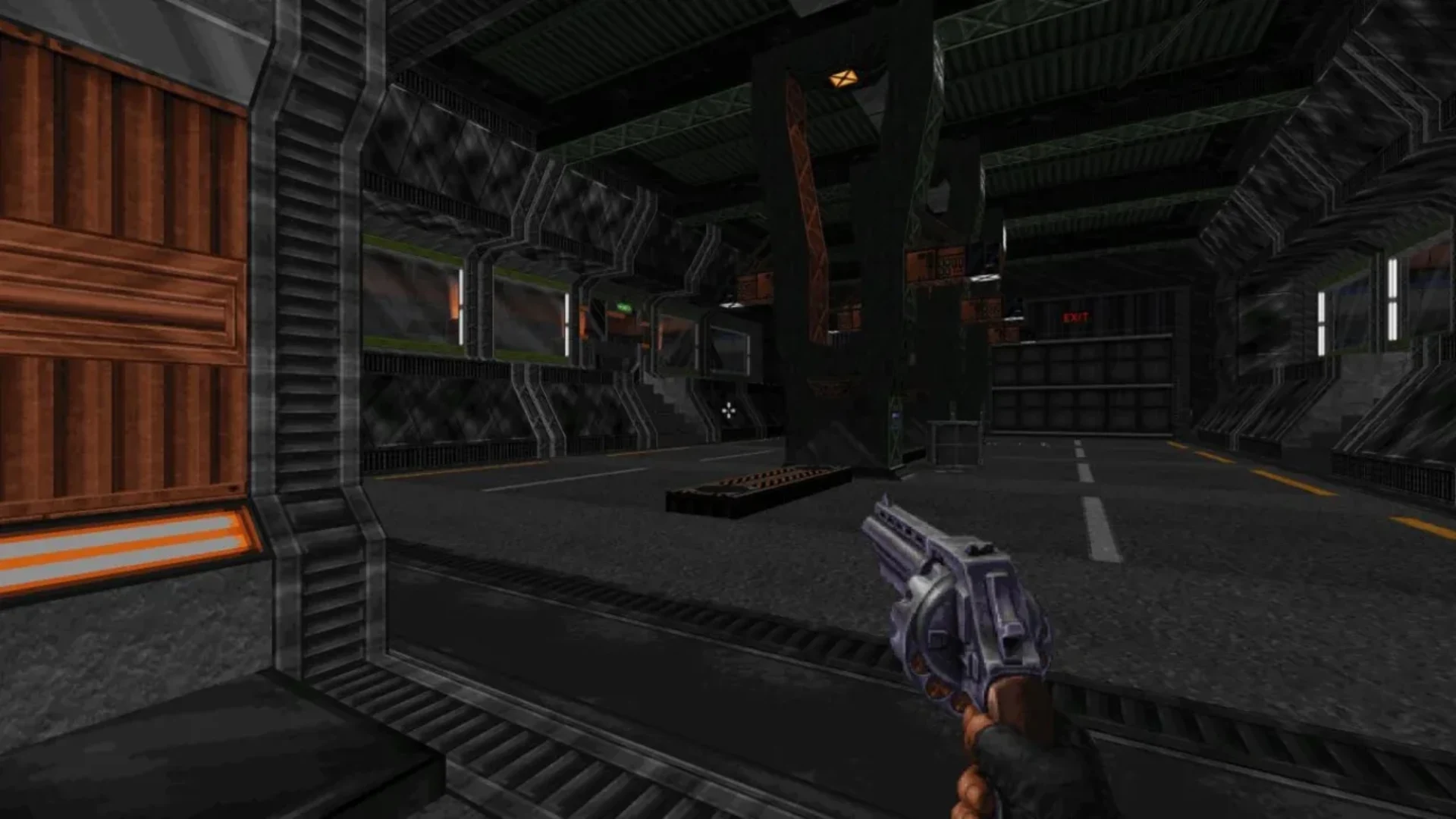 Player holds a pistol while exploring a dark industrial facility in Ion Fury.