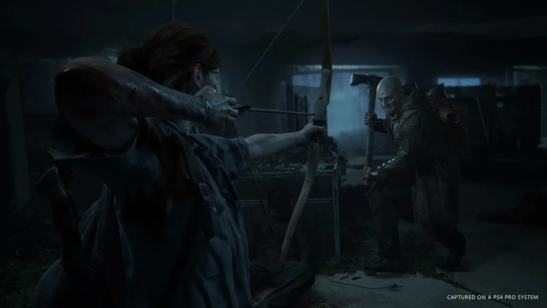 Ellie aims a bow at an approaching enemy during a dark encounter in The Last of Us Part II.