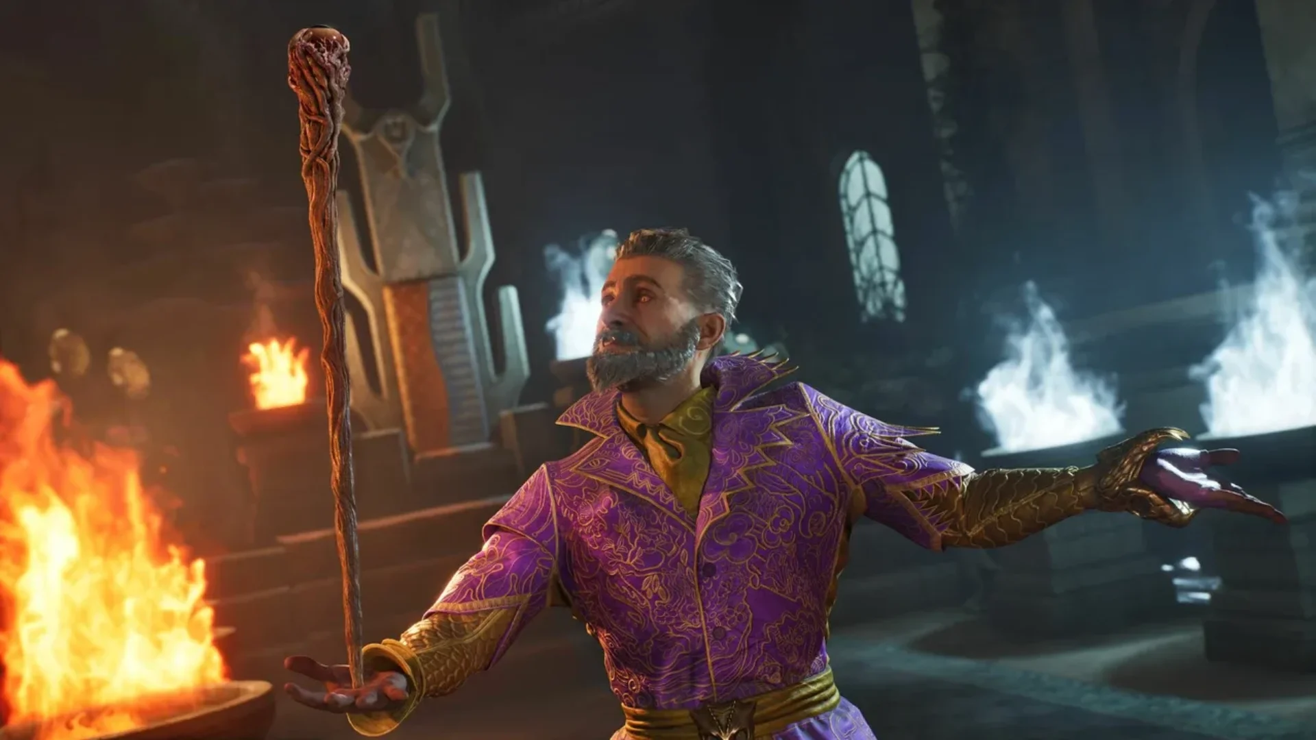 A mage in ornate purple clothing holds a staff beside flames in Oblivion Remastered.