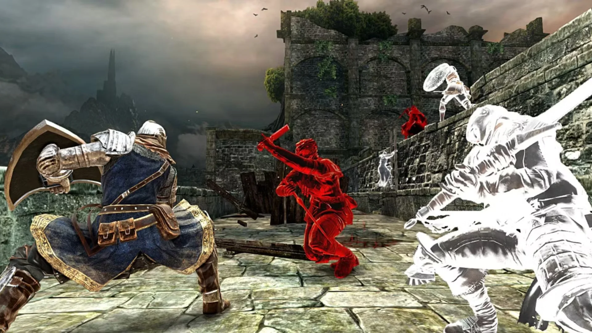 Dark Souls 2 players fight red and white phantoms together on a stone platform near ruined castle walls.