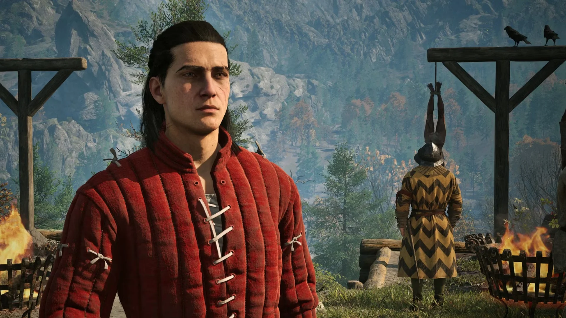 Coen stands near a gallows with mountains and autumn forests behind him in The Blood of Dawnwalker.