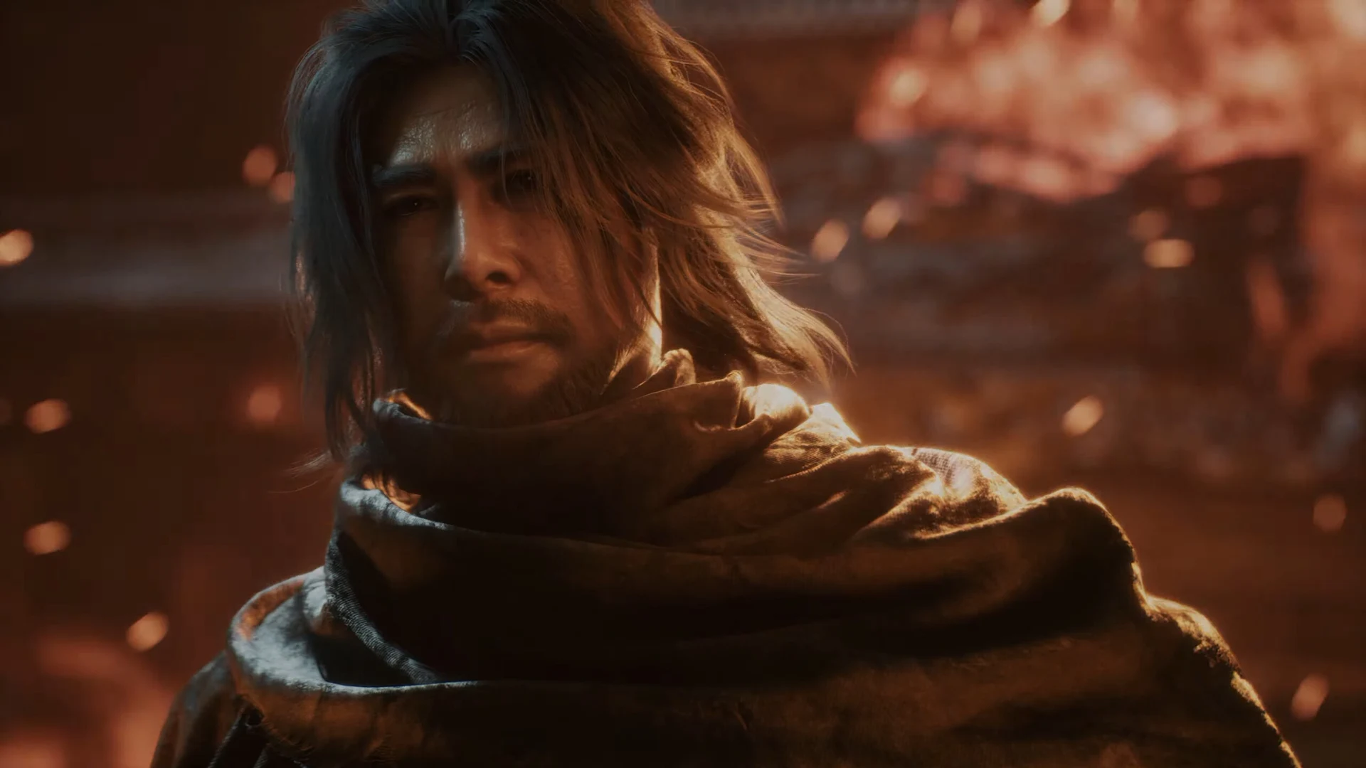Mó Yuan appears in a close-up scene surrounded by warm firelight in Phantom Blade Zero.