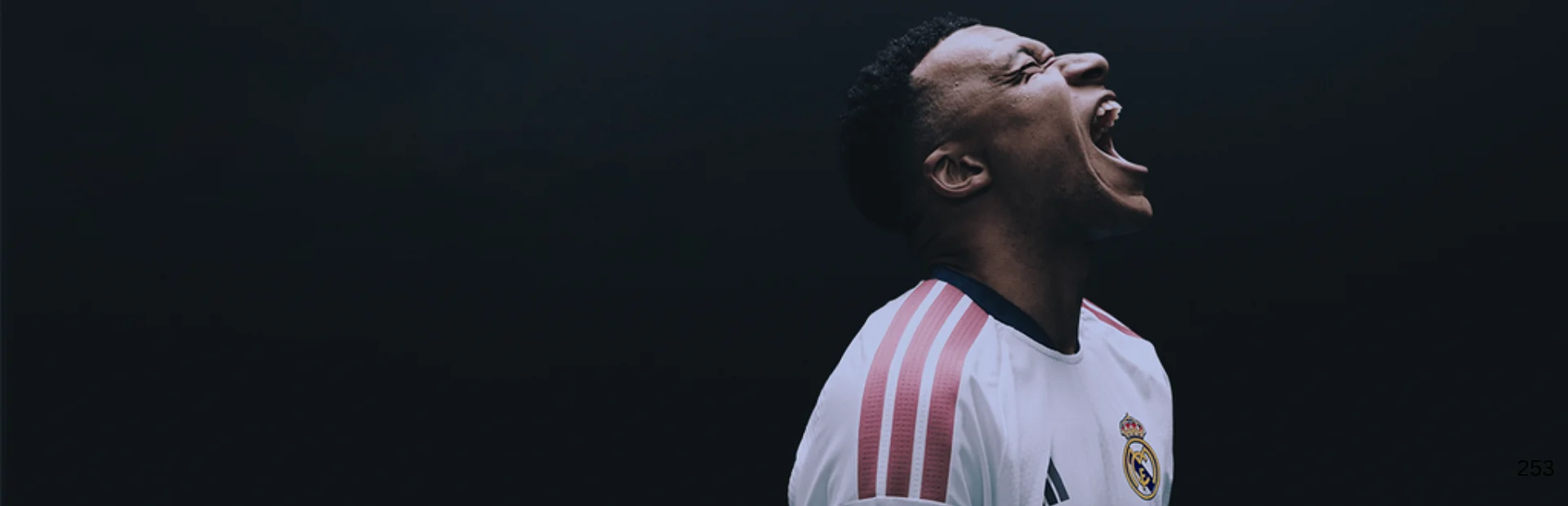 Real Madrid player celebrates during an EA Sports FC 27 match against a dark background.