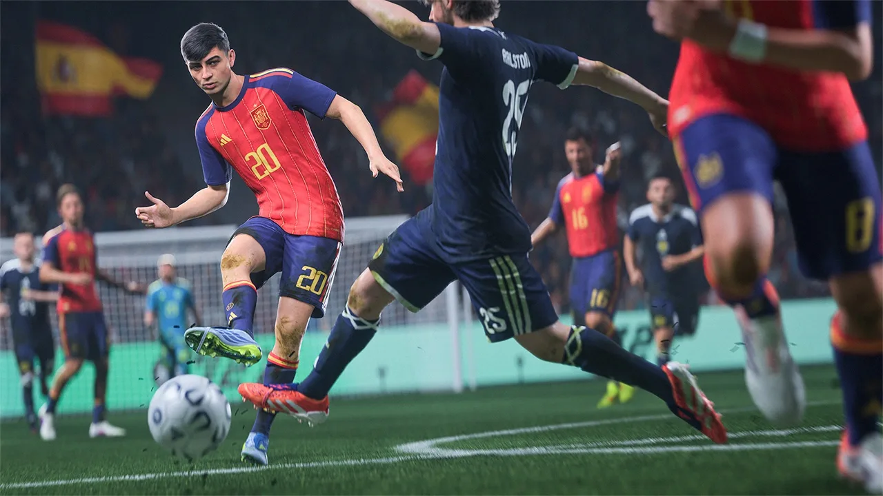 A Spain player wearing number 20 strikes the ball as a Scotland defender attempts to block him in EA Sports FC.