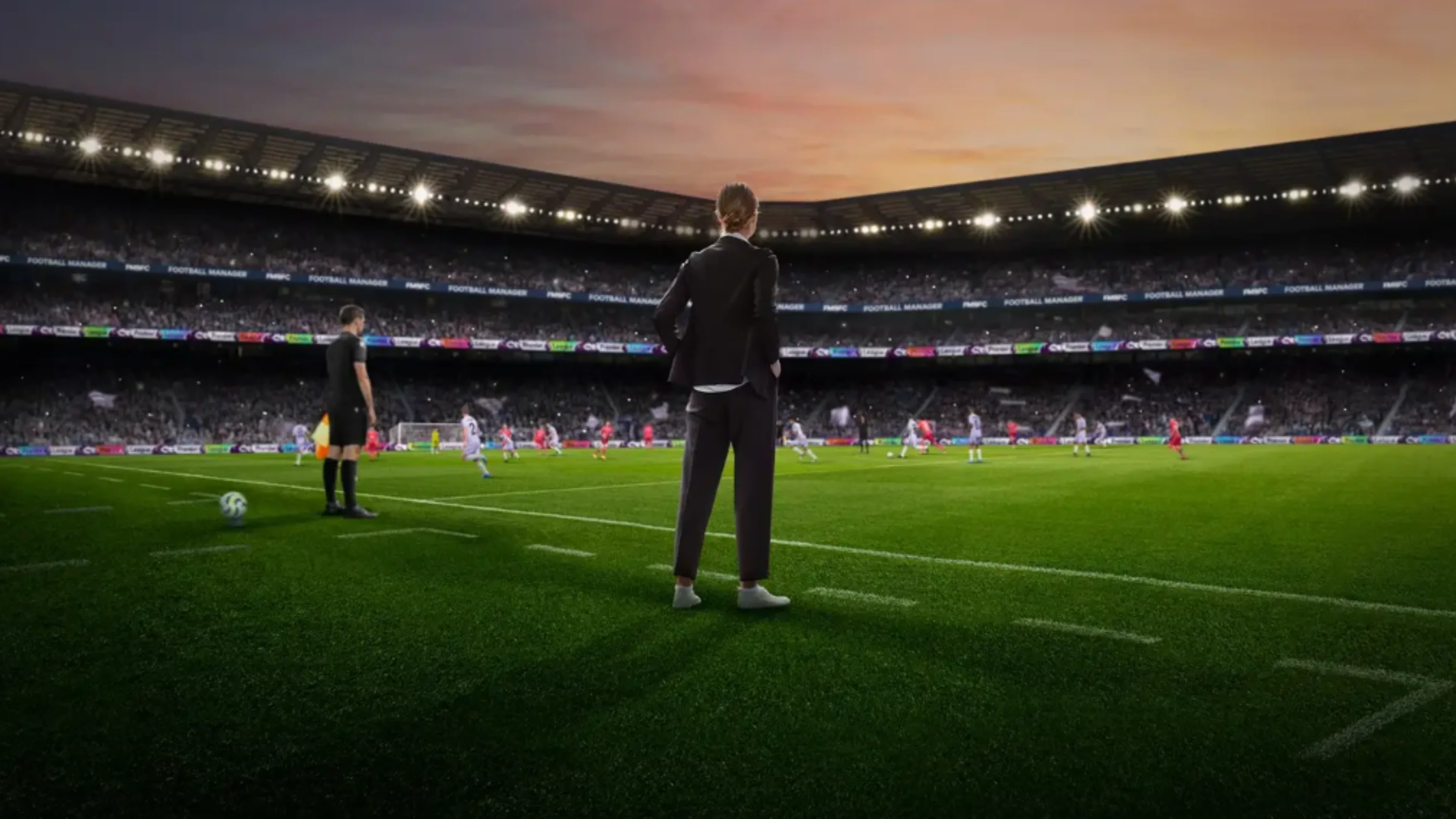 A football manager watches a match from the touchline inside a packed stadium at sunset in Football Manager 27.
