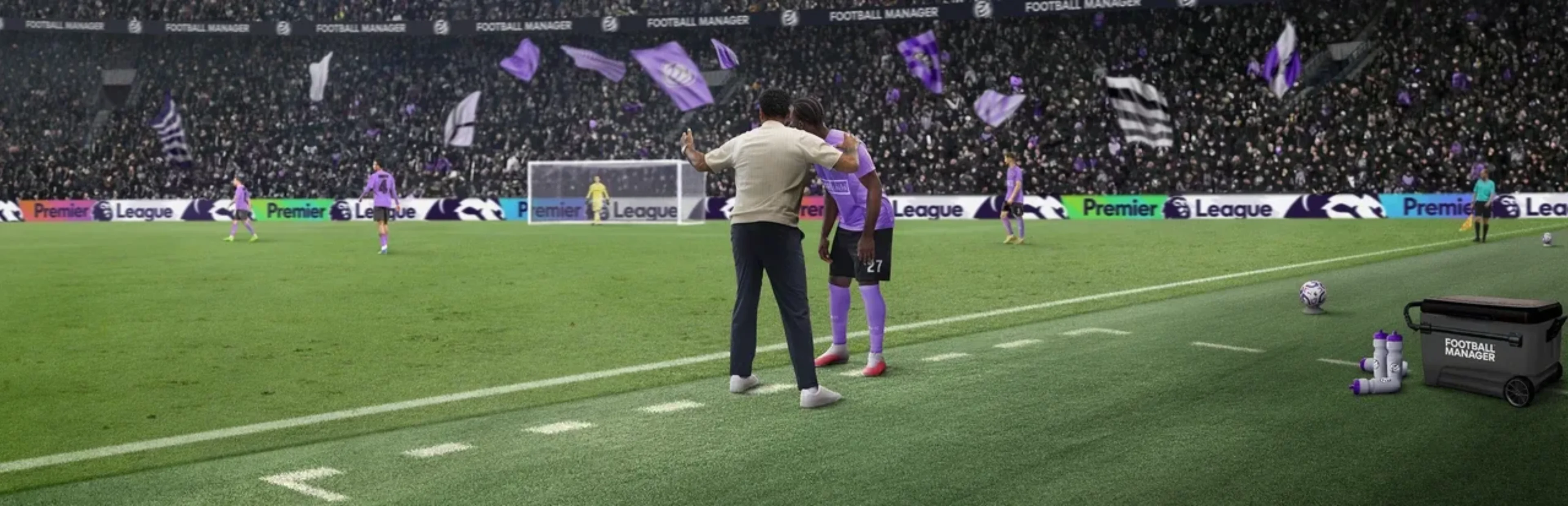A manager gives instructions to a player in a purple kit beside the pitch in Football Manager 27, with a packed stadium behind them.