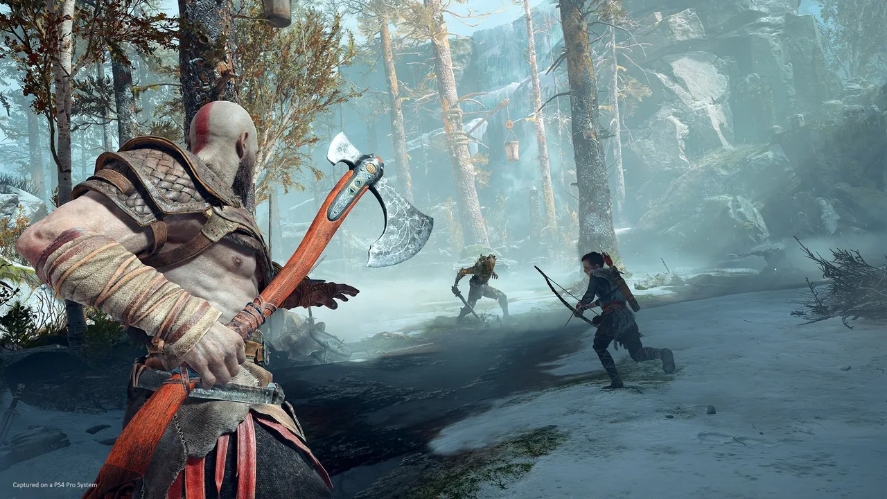 Kratos holding the Leviathan Axe while Atreus prepares his bow during combat in God of War.