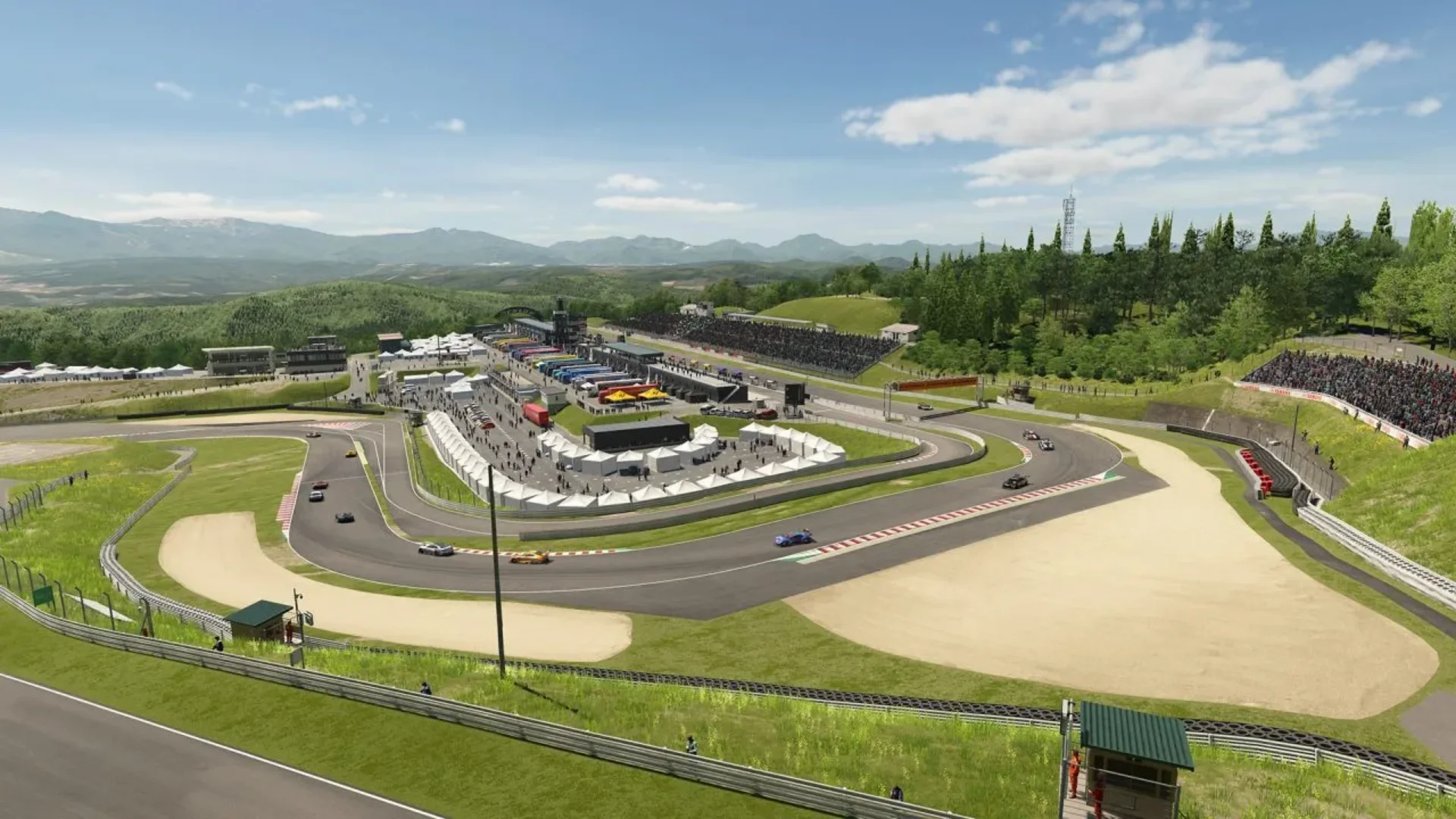 Sportsland SUGO circuit stretches through green hills as multiple cars race around the track in Gran Turismo 7.