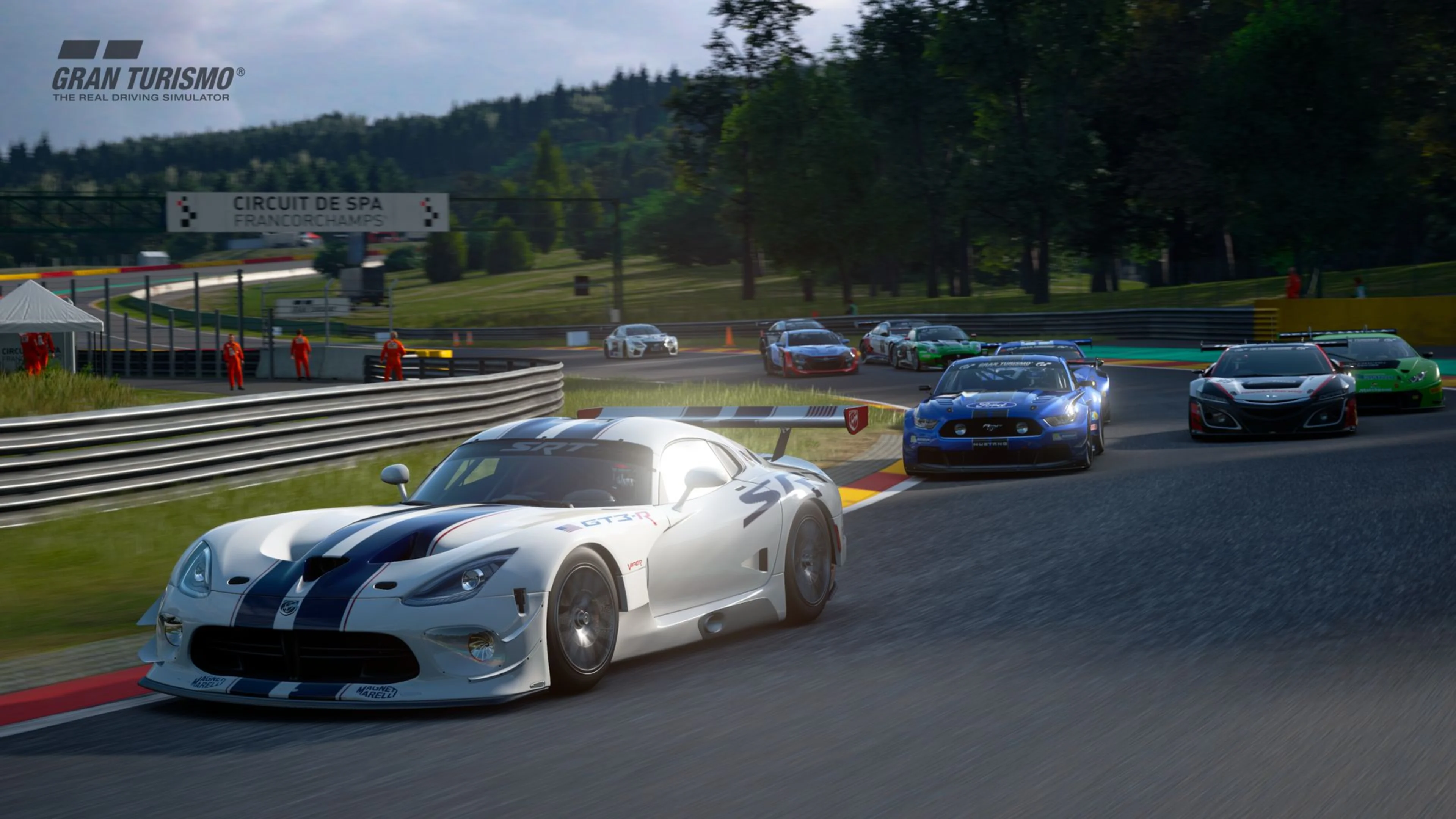 White Dodge Viper race car leads several competitors around a corner at Circuit de Spa-Francorchamps in Gran Turismo 7.