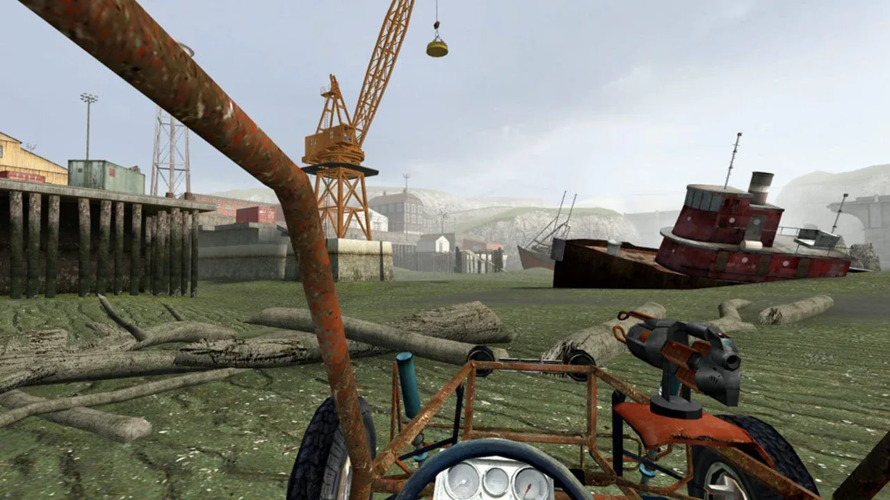The player drives a dune buggy through an abandoned coastal shipyard in Half-Life 2.