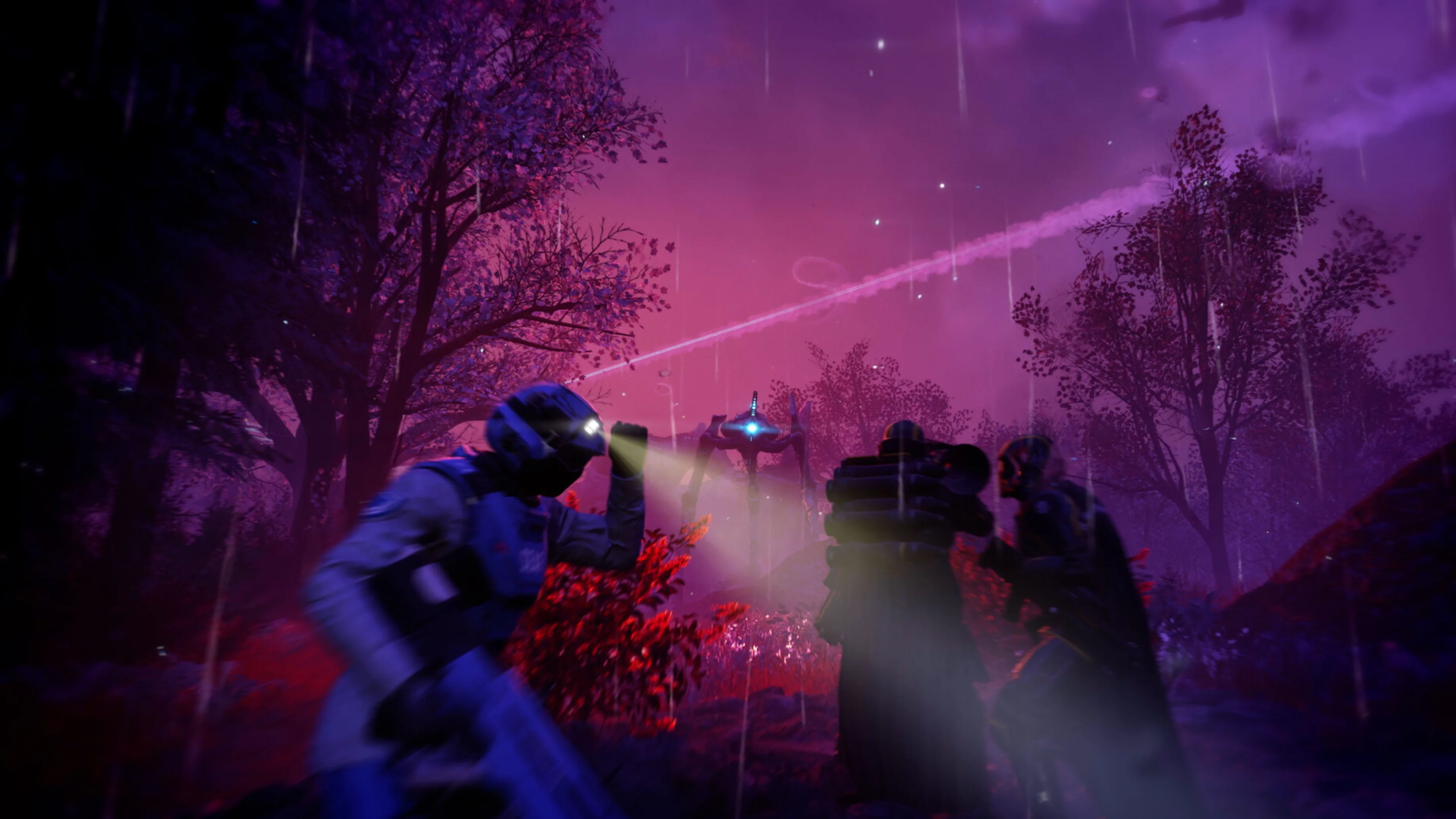 Two armored Helldivers stand near a large structure as a glowing alien machine approaches through a rainy purple landscape.