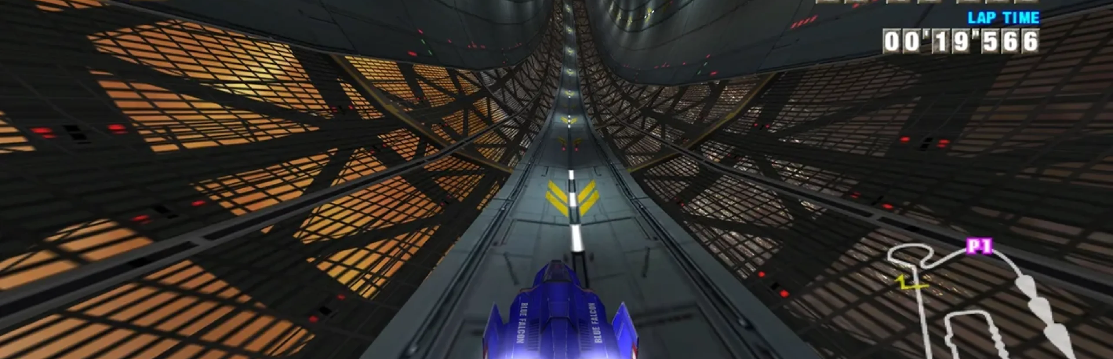 F-Zero GX gameplay showing the Blue Falcon racing along a steep metallic track inside a futuristic tunnel with a lap timer.
