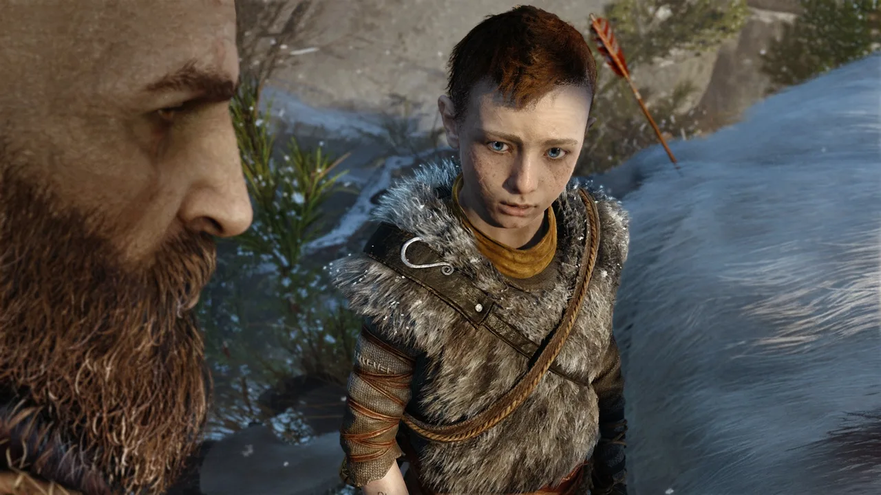 Kratos talking with Atreus during a story scene in God of War.