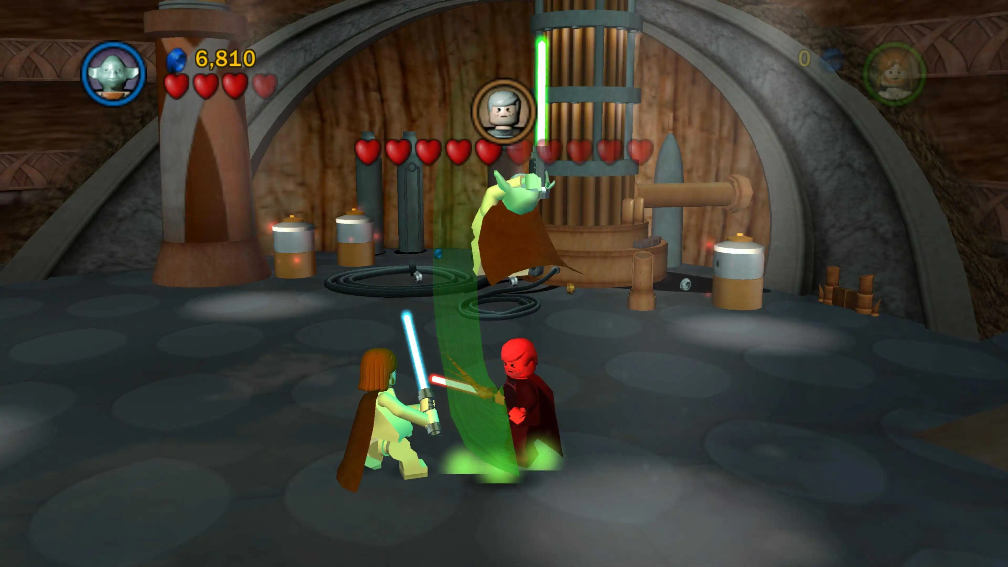 Yoda leaps over two lightsaber-wielding LEGO characters during a battle inside an industrial room.