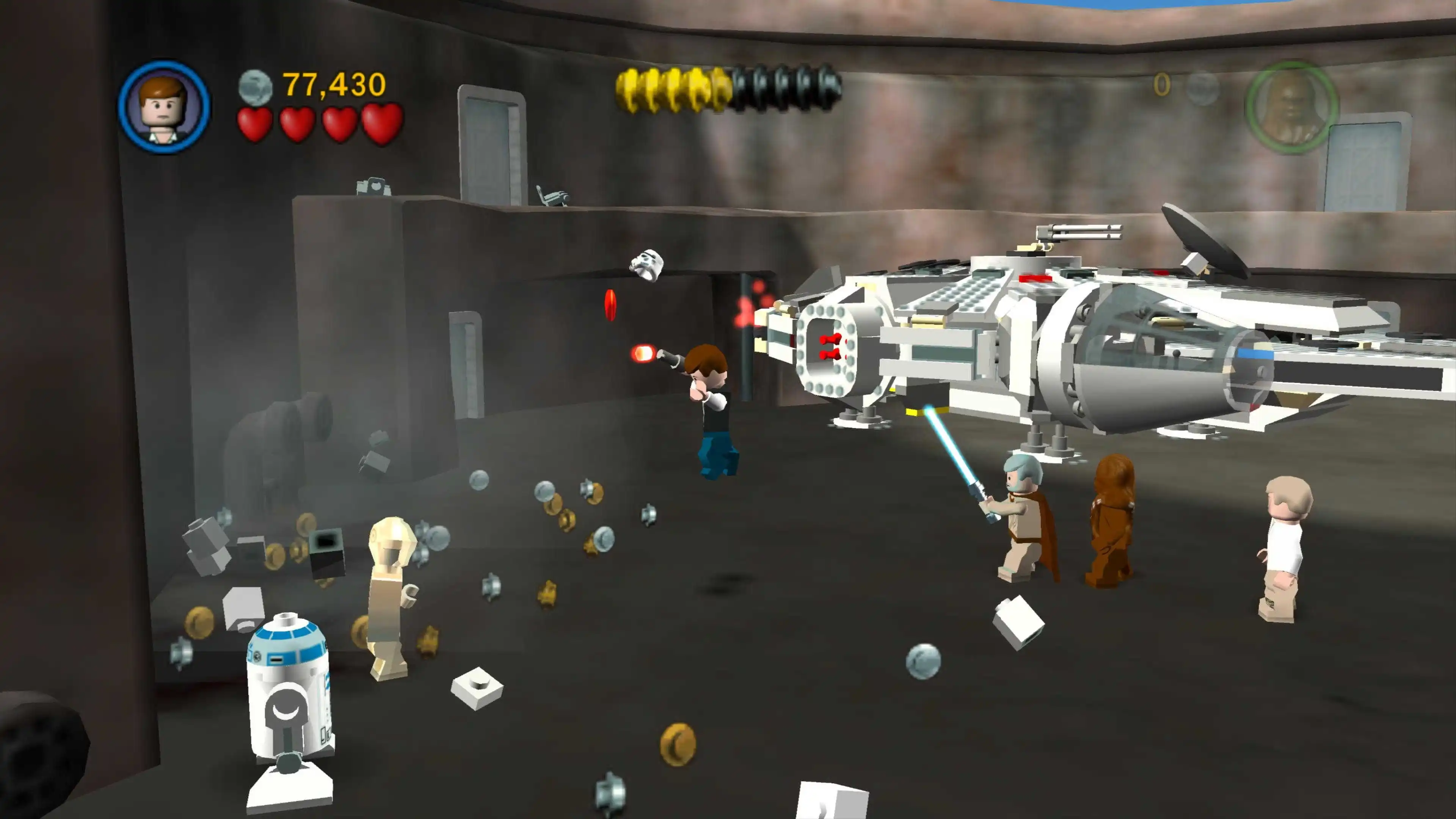 Han Solo fires a blaster while Obi-Wan, Chewbacca and other heroes fight beside the Millennium Falcon.