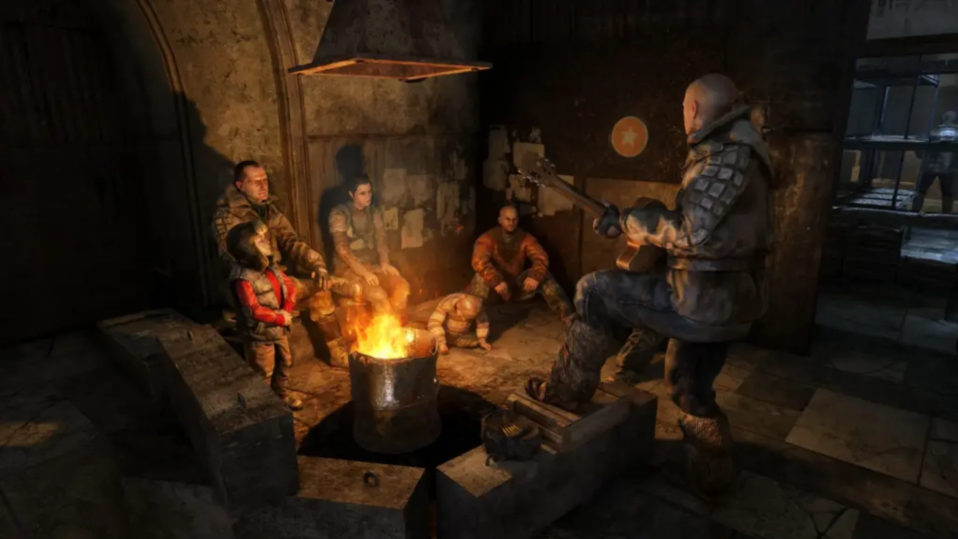 Metro survivors gather around a burning barrel while one plays guitar inside an underground settlement.