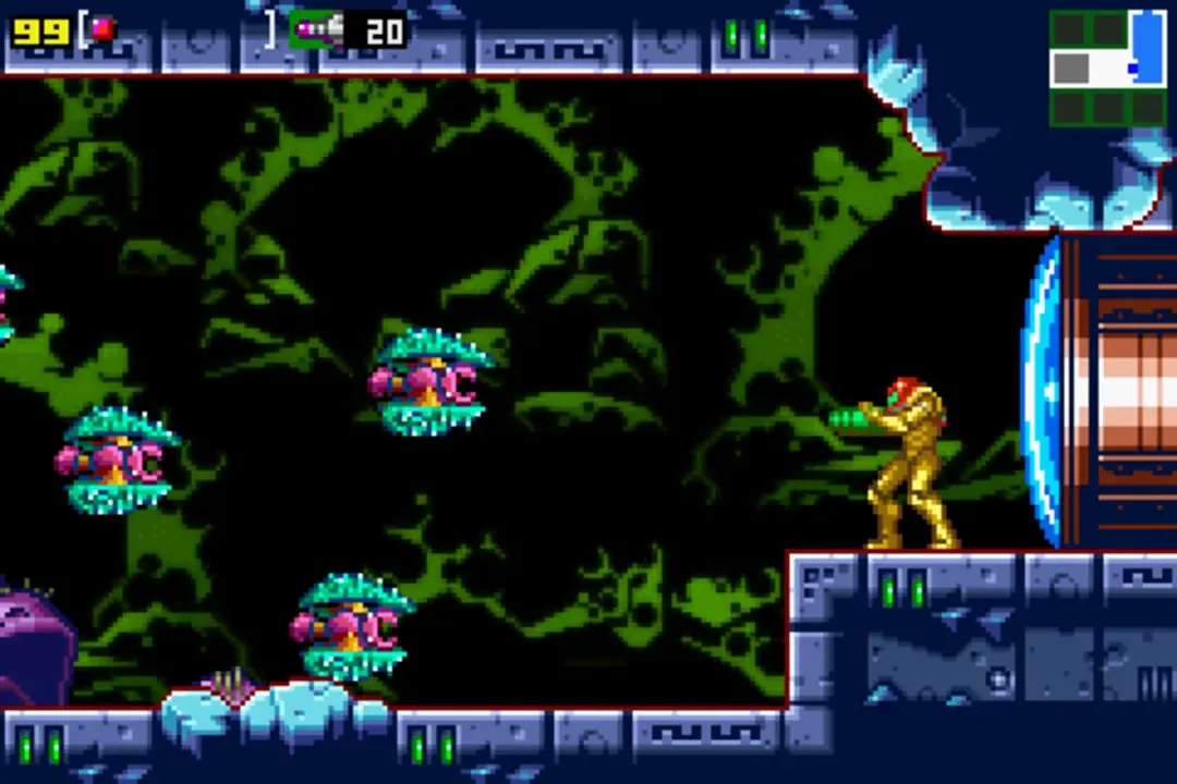 Samus aims at floating enemies beside a blue doorway in Metroid: Zero Mission.