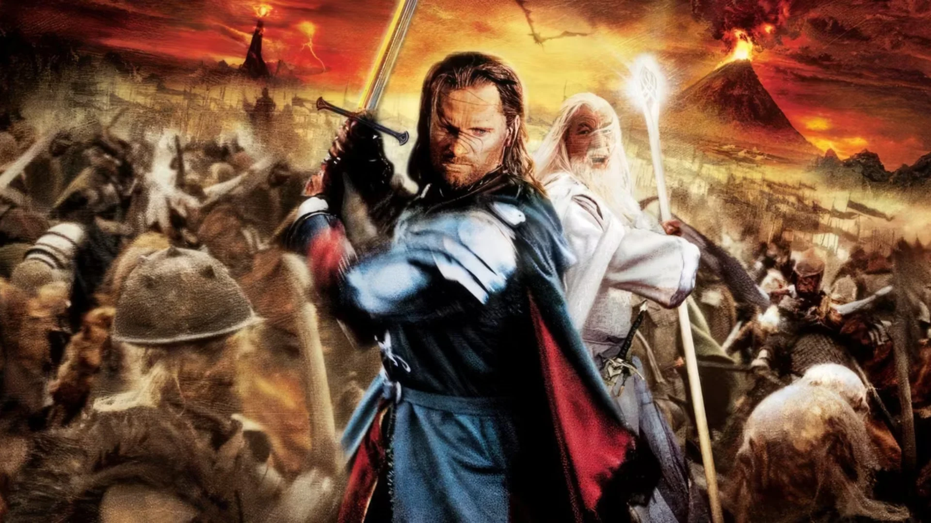 Two warriors stand before a huge Middle-earth battle as armies clash beneath a fiery sky and erupting volcanoes.