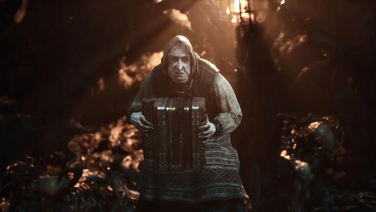 A pale, elderly creature plays an accordion in a dimly lit cavern in Mortal Shell II.