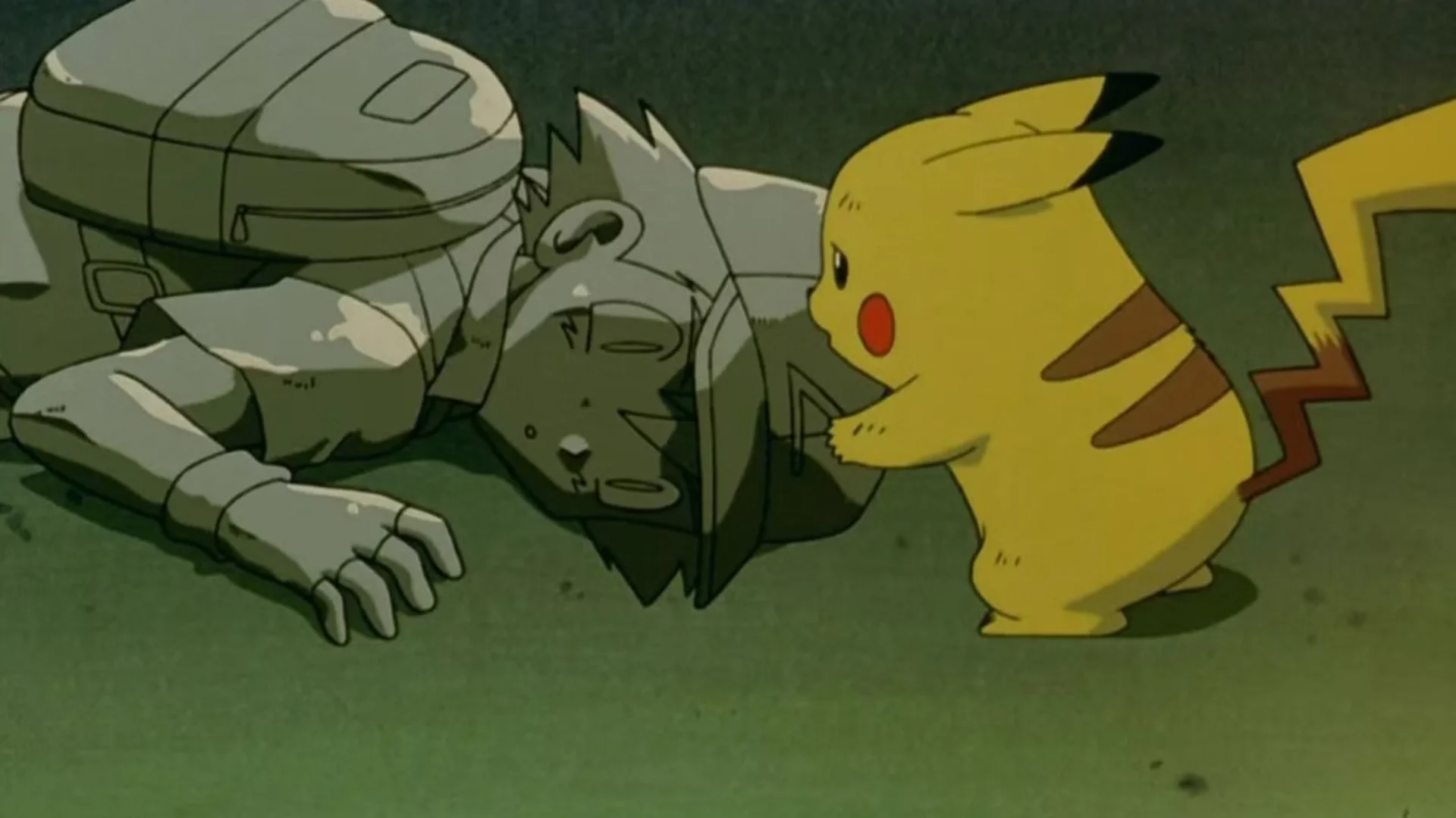 Pikachu stands beside Ash Ketchum as he lies on the ground.