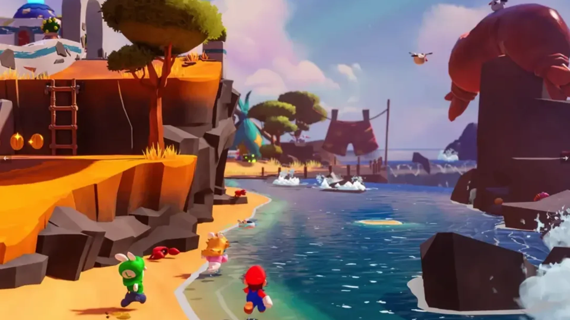 Mario and his companions run along a colorful coastal area in Mario + Rabbids Sparks of Hope.