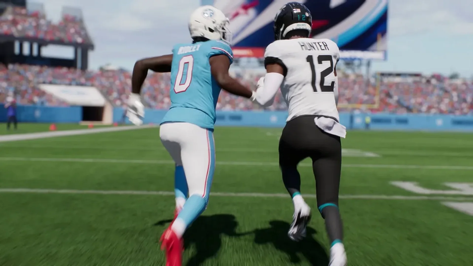 Two Madden NFL 27 players run side by side on the field during a football play.