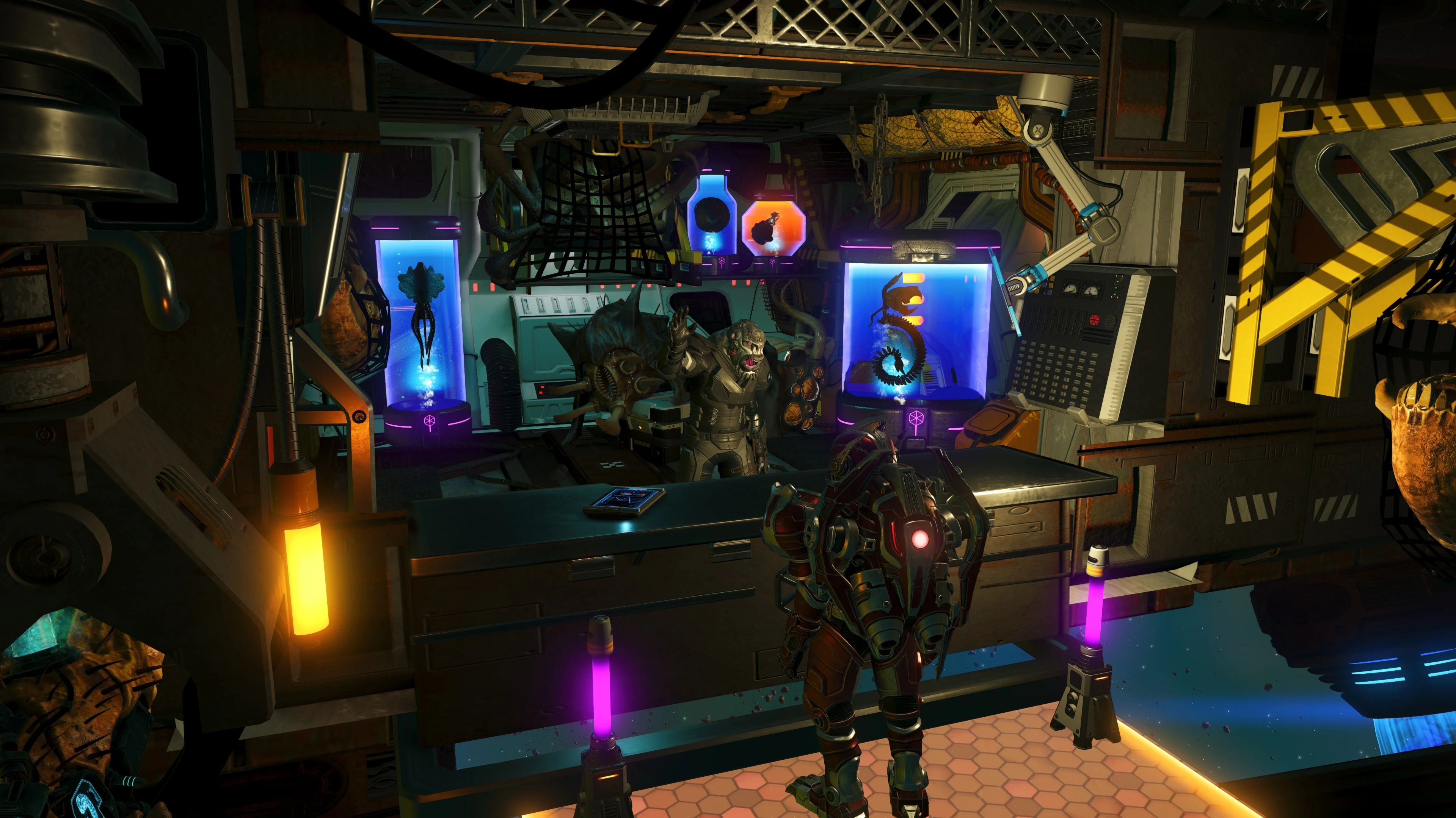 An armored player character faces an alien trader inside a futuristic space station filled with glowing specimen tanks in No Man’s Sky.