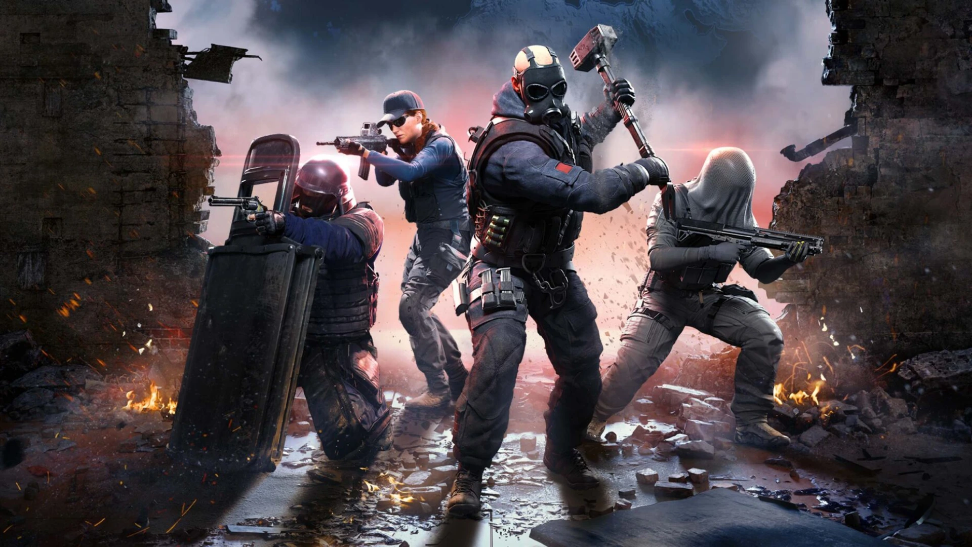 Four Rainbow Six Operators pose with weapons among ruined buildings