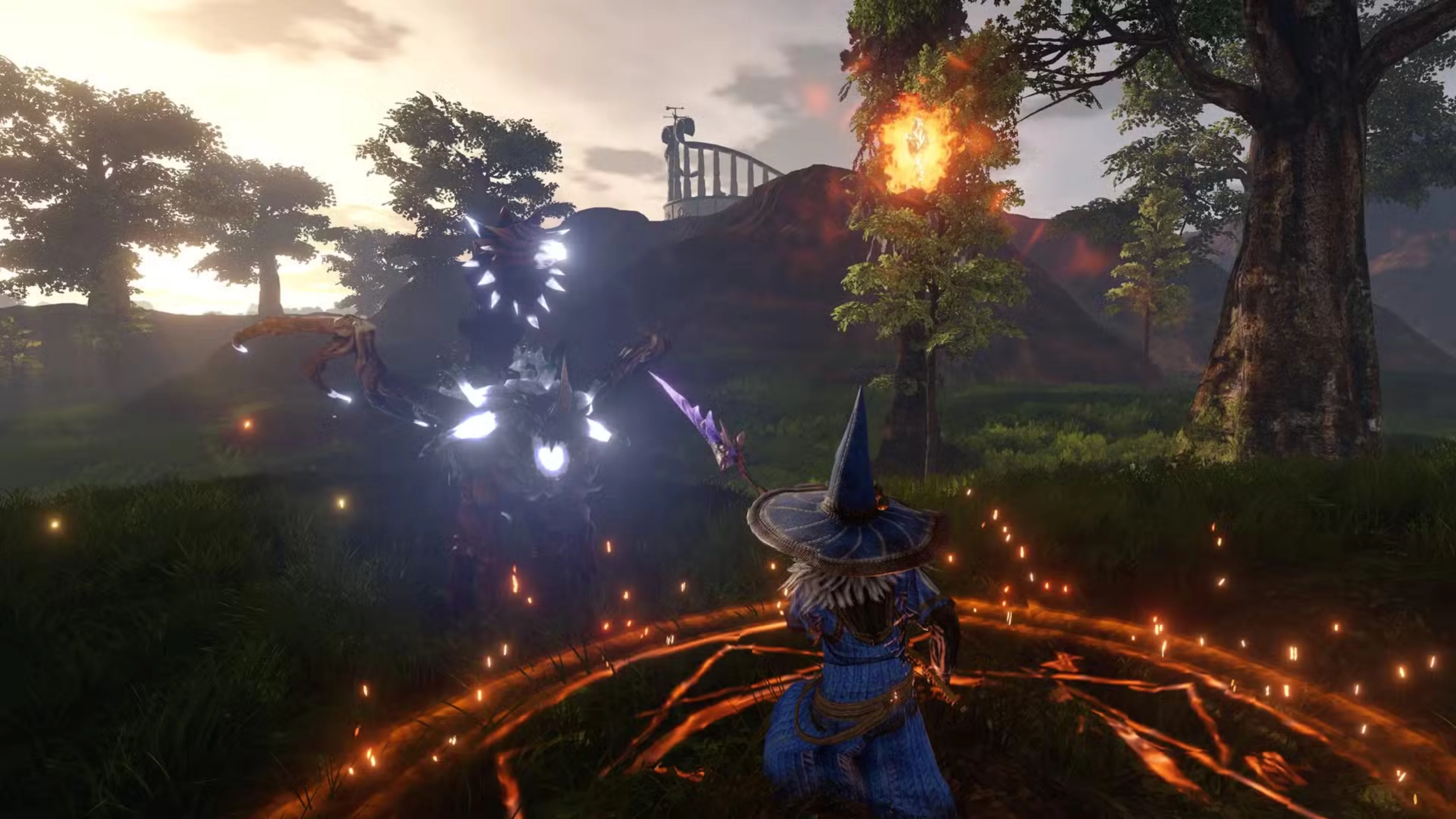 A mage wearing blue robes and a pointed hat faces a glowing monster while standing inside a fiery magic circle in Rewolt.