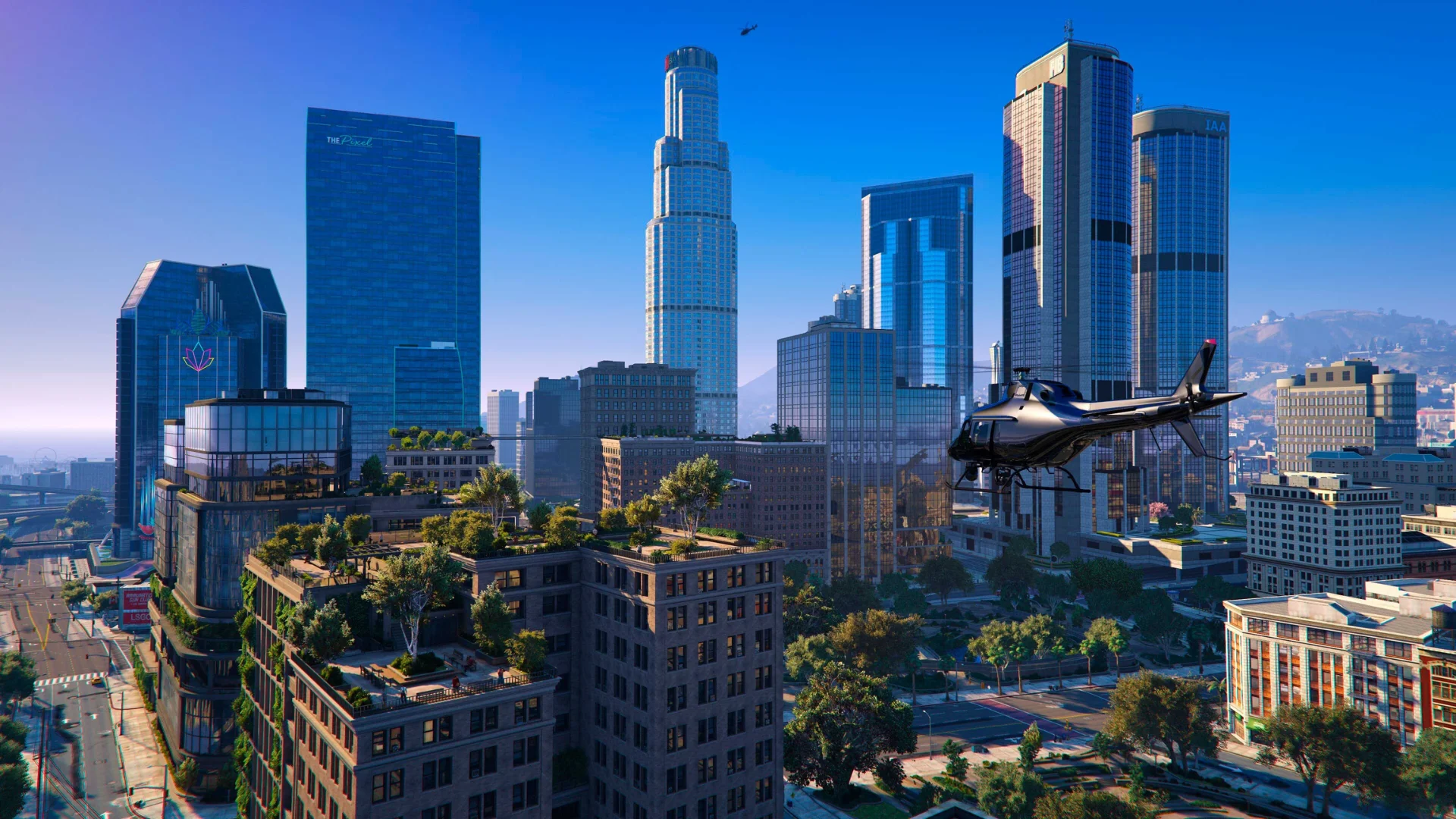 A helicopter flies above the Los Santos skyline and downtown skyscrapers in Grand Theft Auto V.