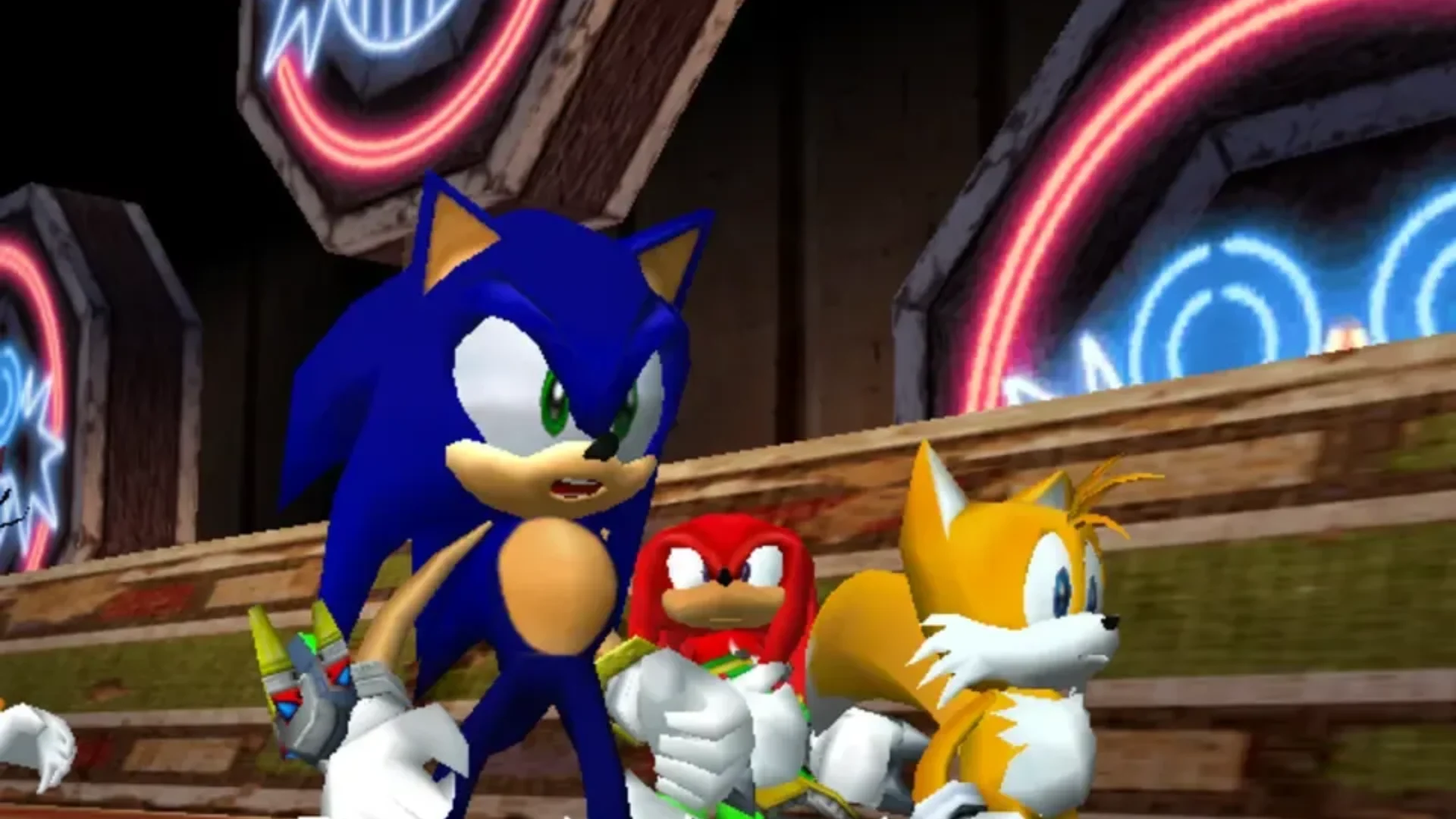 Sonic, Knuckles, and Tails pose together in a bright coastal environment in Sonic Heroes.
