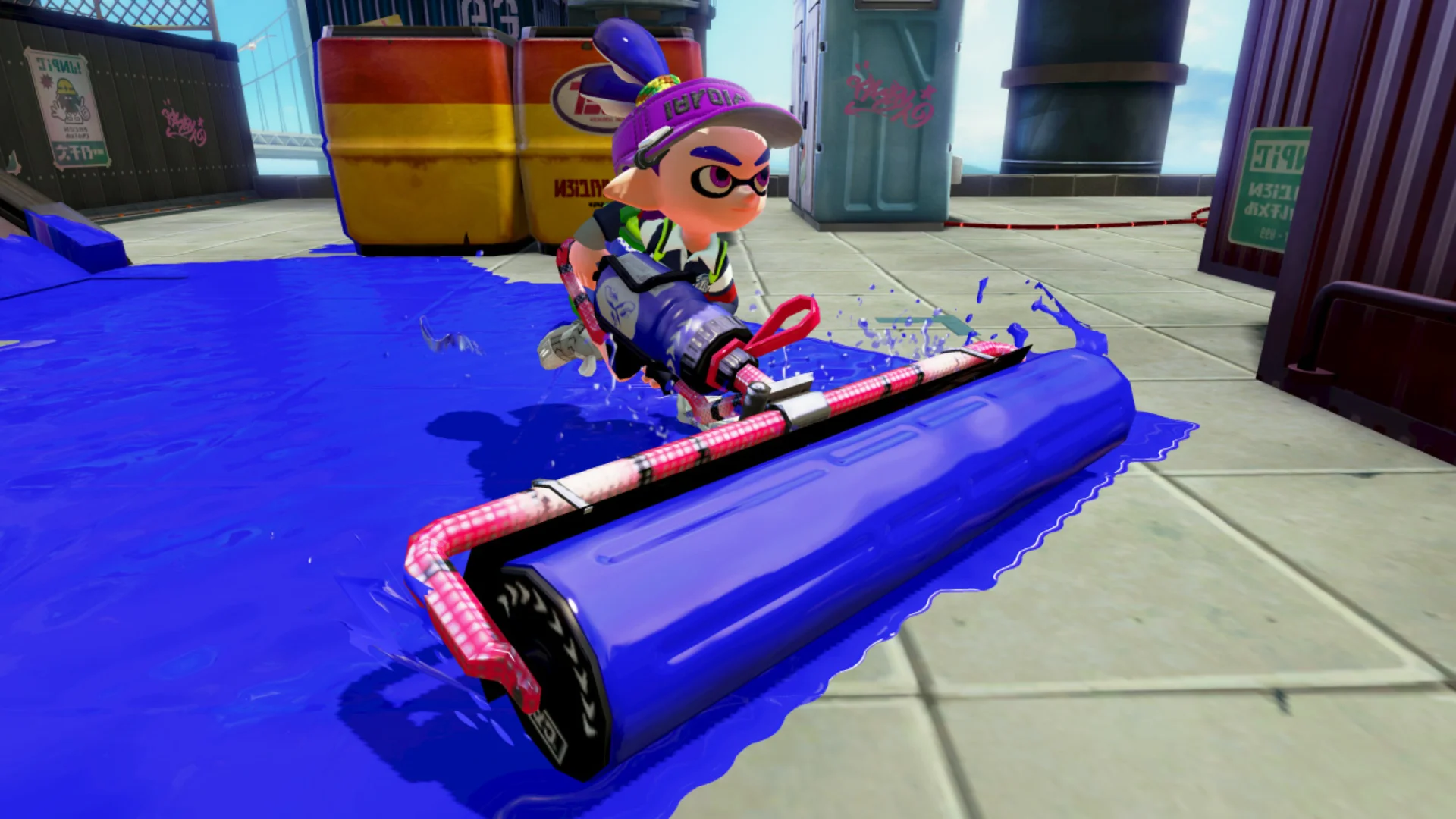 An Inkling pushes a large roller through blue ink during a Splatoon 3 multiplayer match.