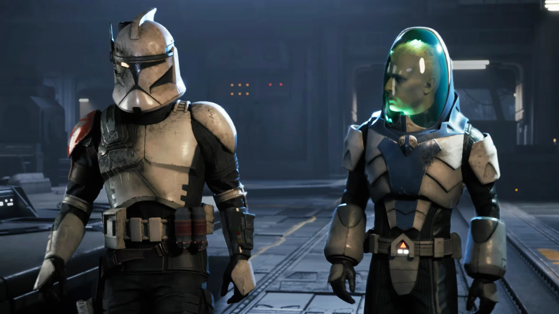 A weathered clone trooper stands beside an armored operative with a green-lit helmet inside a futuristic facility.
