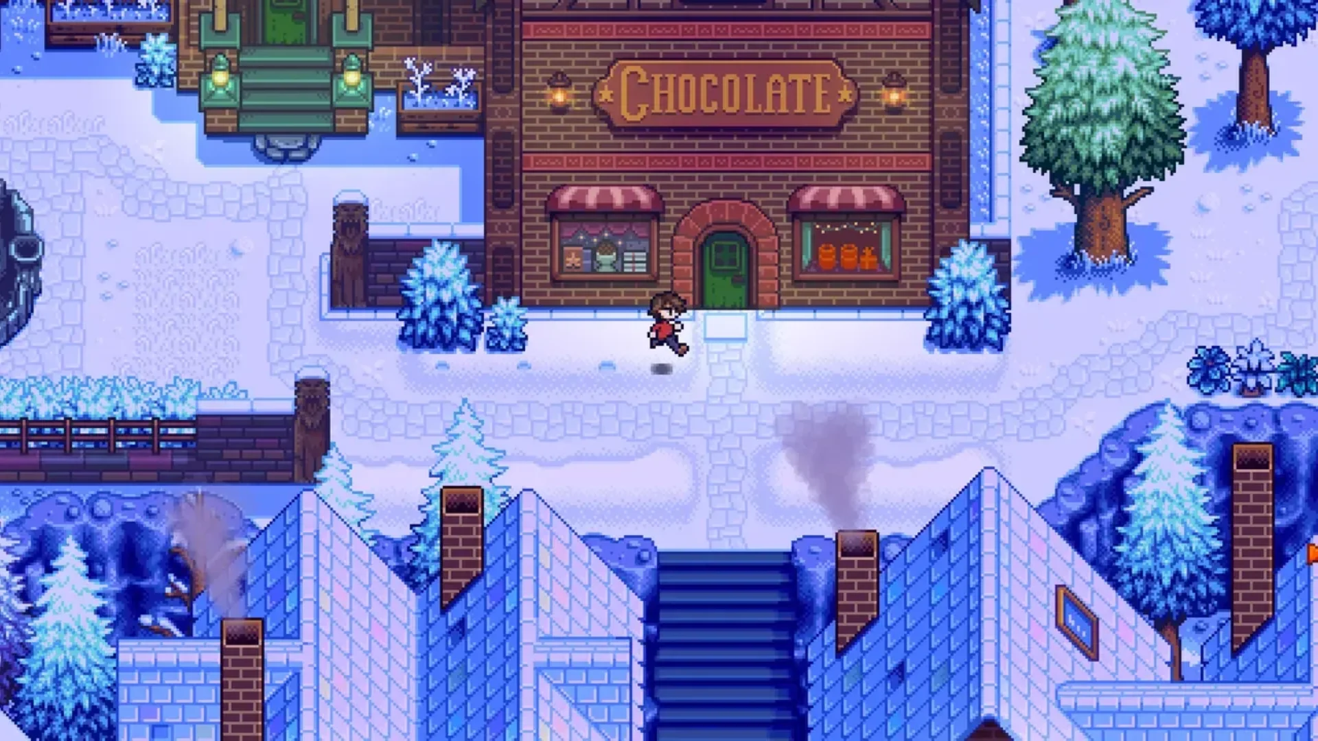 A player character stands outside the chocolate shop in a snowy town in ConcernedApe's Haunted Chocolatier.