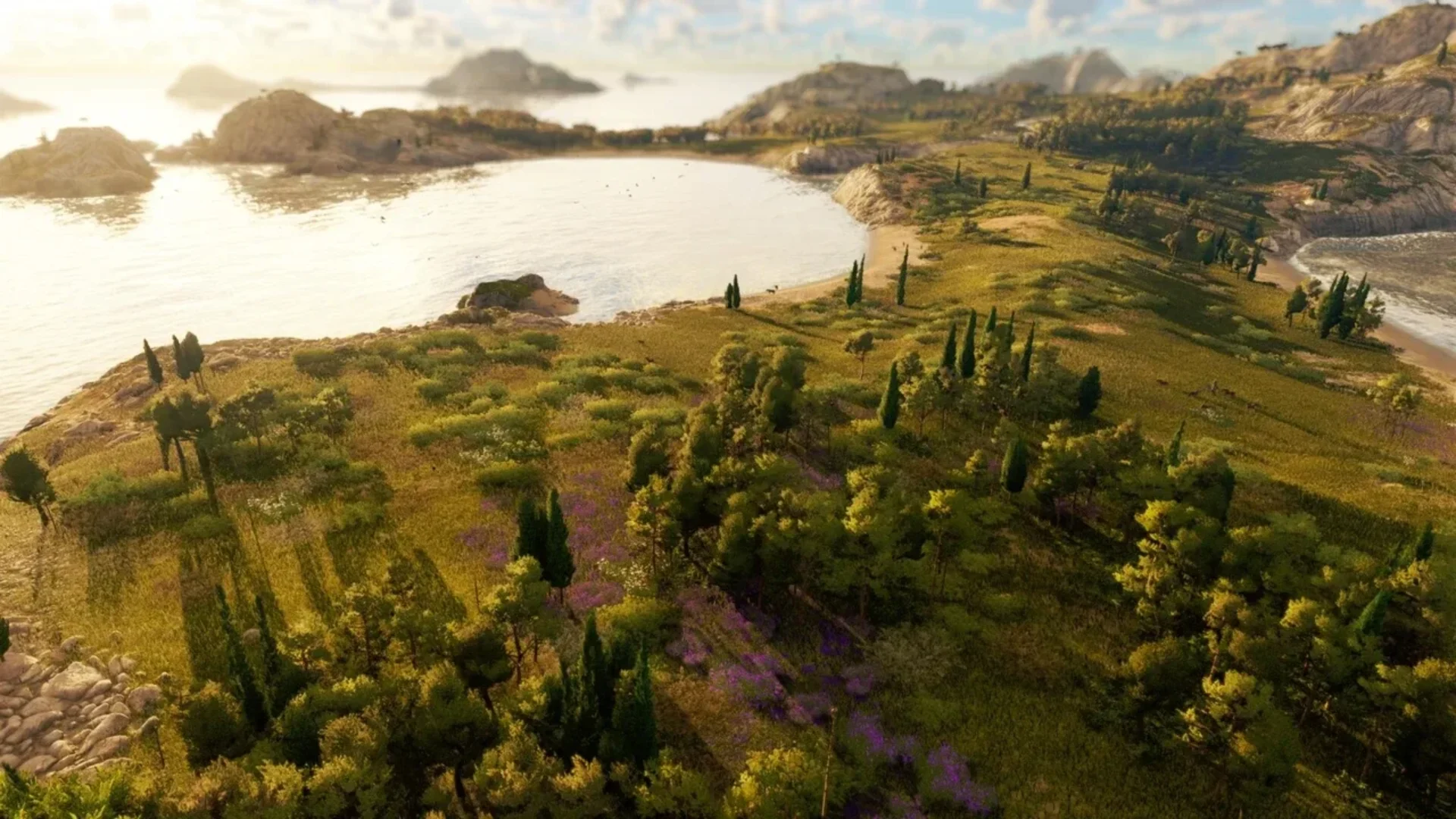 A coastal landscape with forests, fields and rocky shores in Anno 117: Pax Romana.