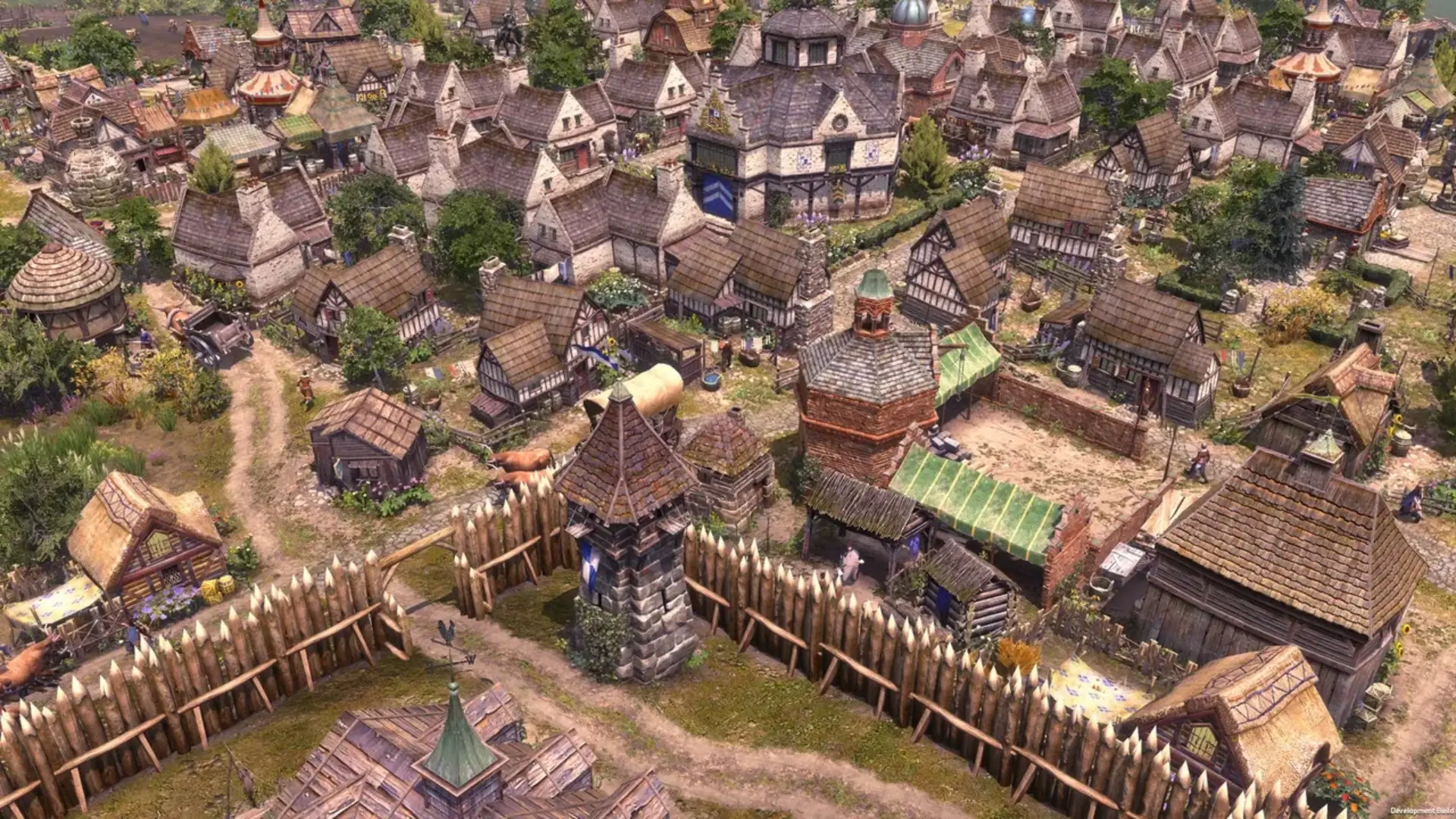 A dense medieval settlement with timber houses, defensive walls and villagers in Farthest Frontier.