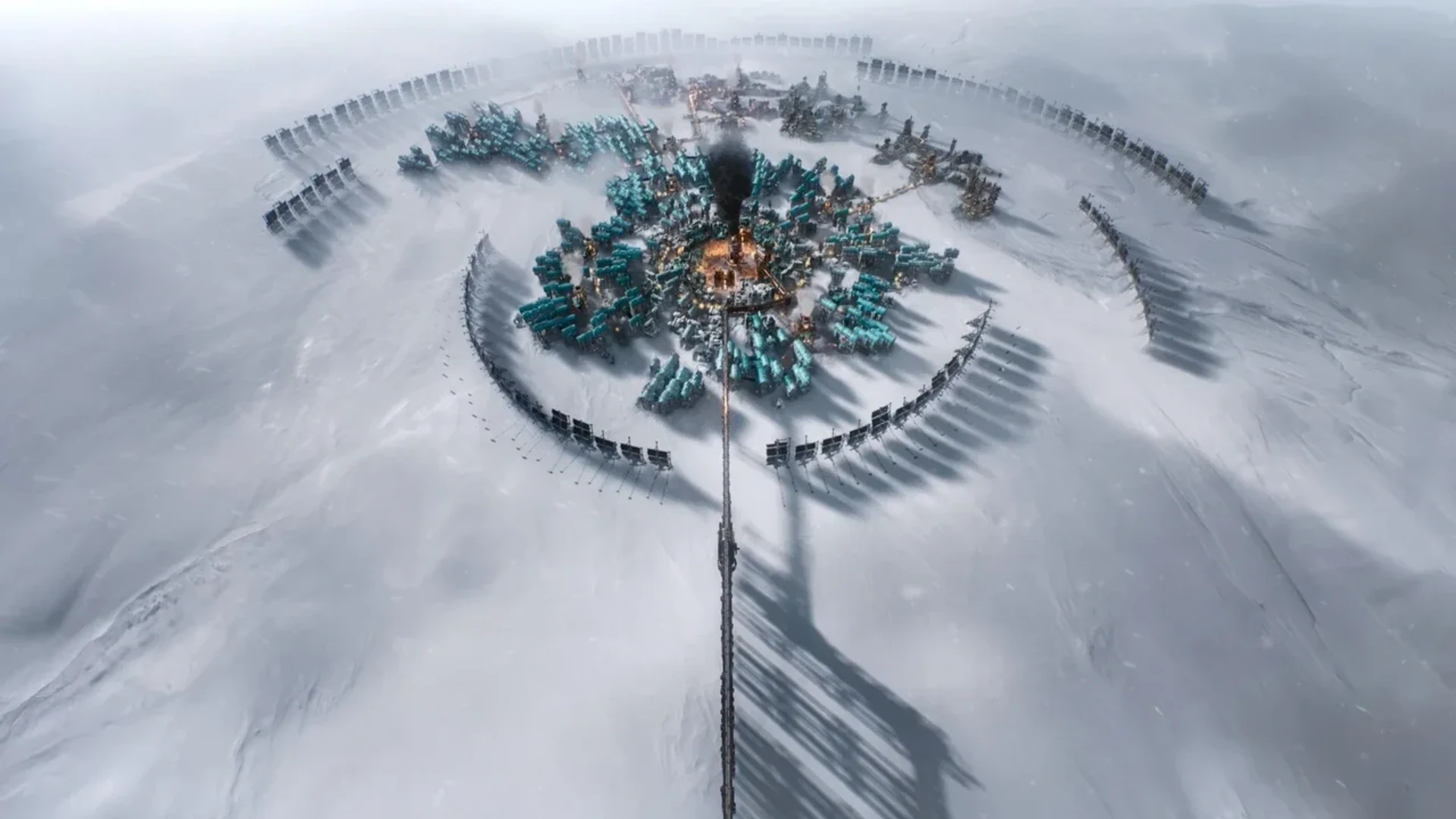 A circular industrial city surrounded by snow and ice in Frostpunk 2.