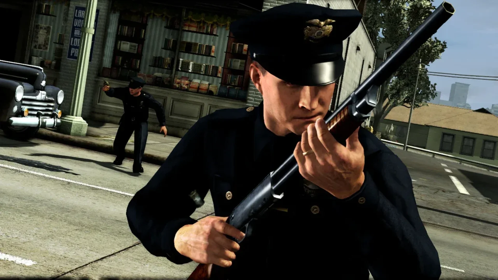 A police officer carries a shotgun during a street confrontation in L.A. Noire.